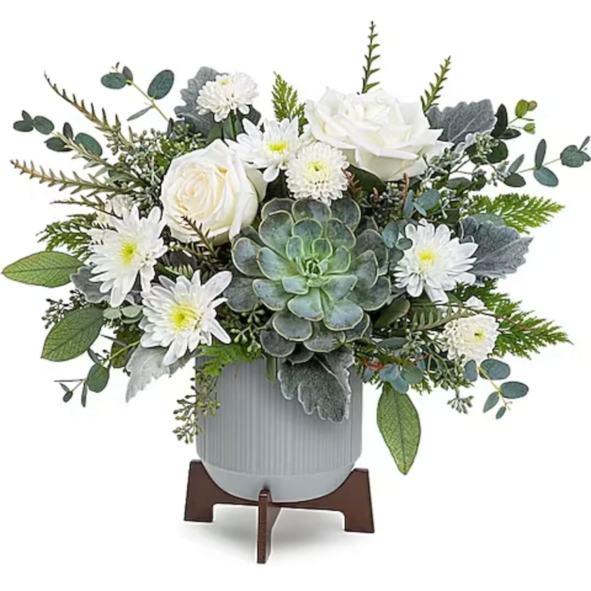 White roses and daisies in a gray vase with a succulent centerpiece