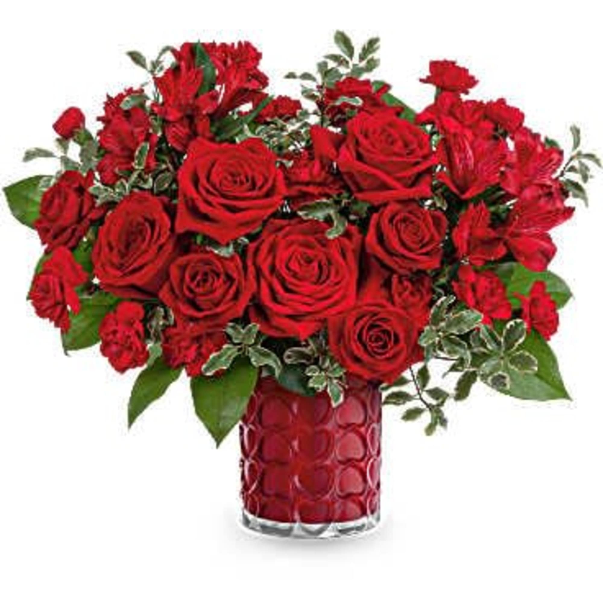 Red roses and carnations in a red glass vase