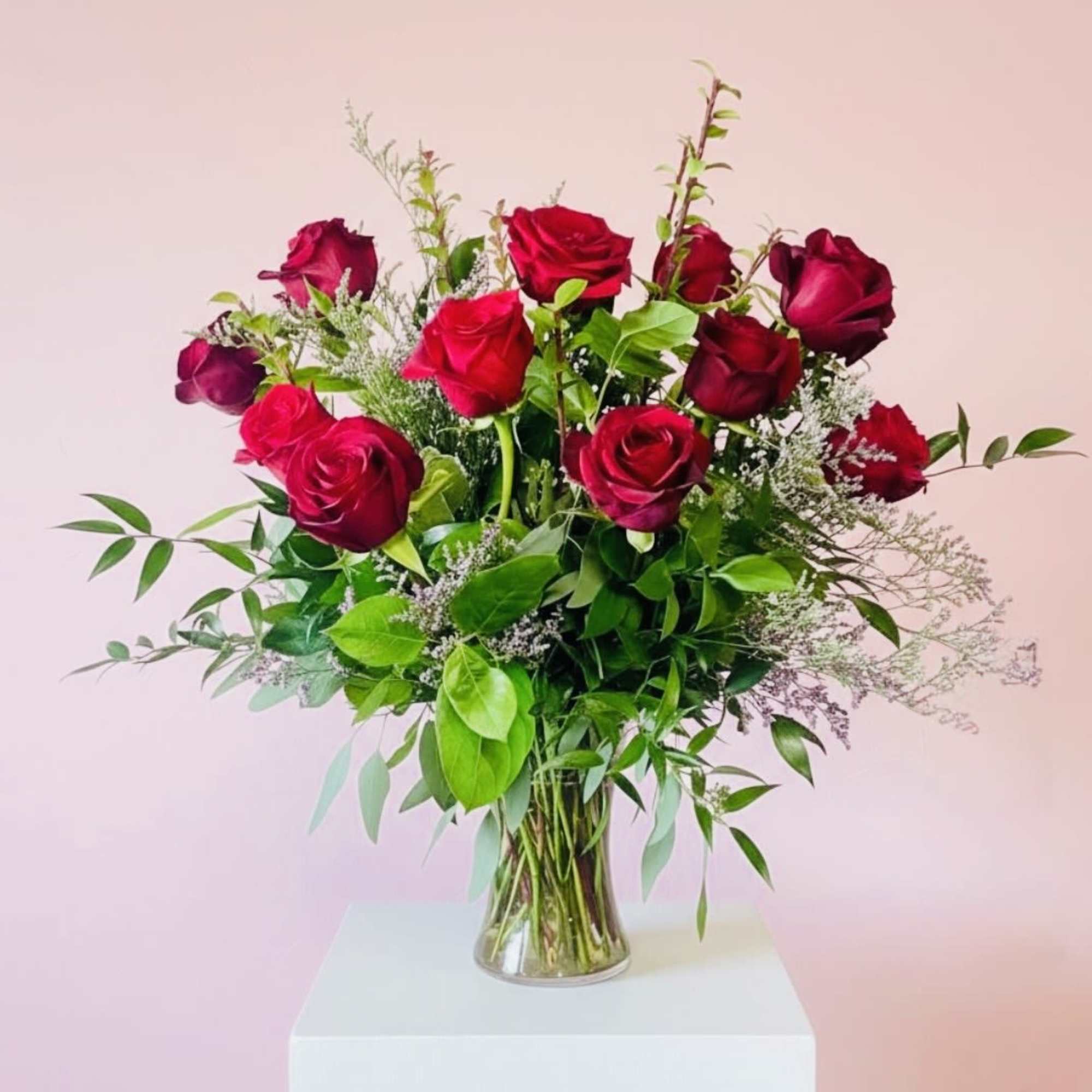 Bouquet of red roses in a clear glass vase
