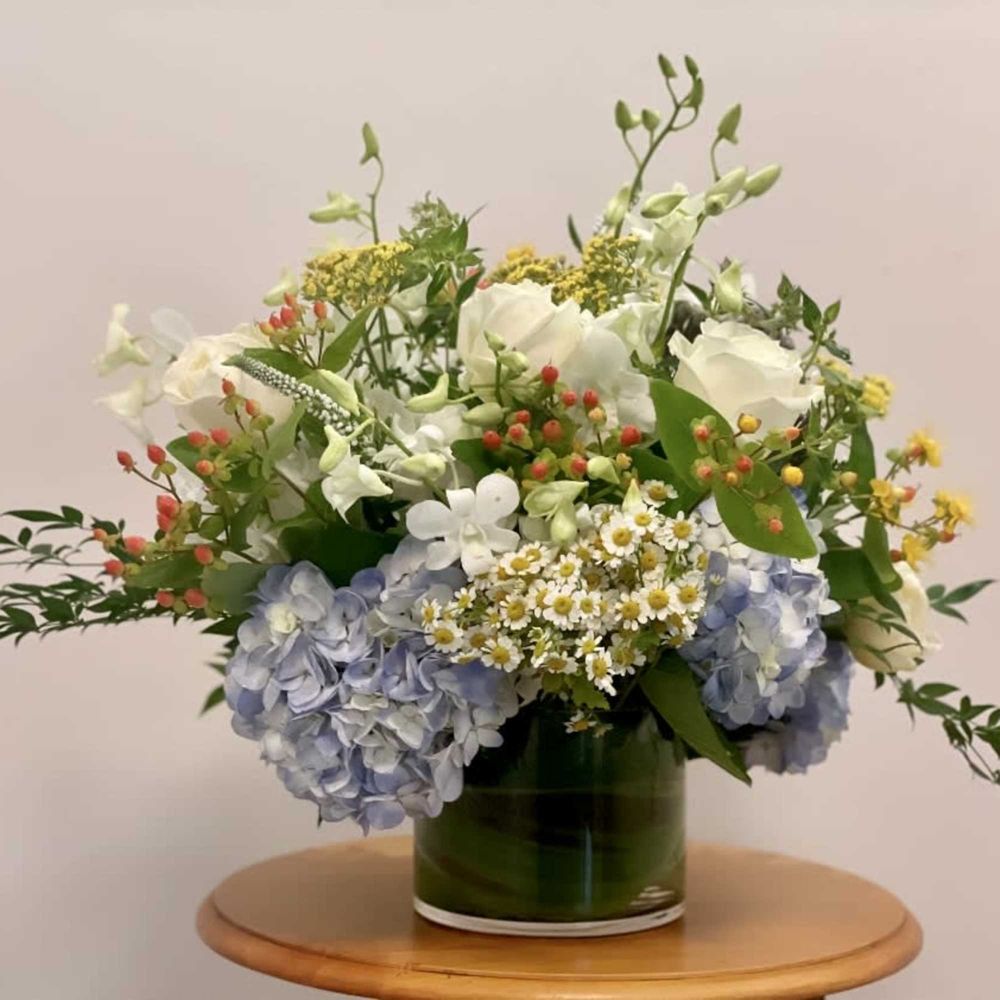 Soft, serene, and effortlessly elegant &mdash; MOLLY is a delicate arrangement featuring