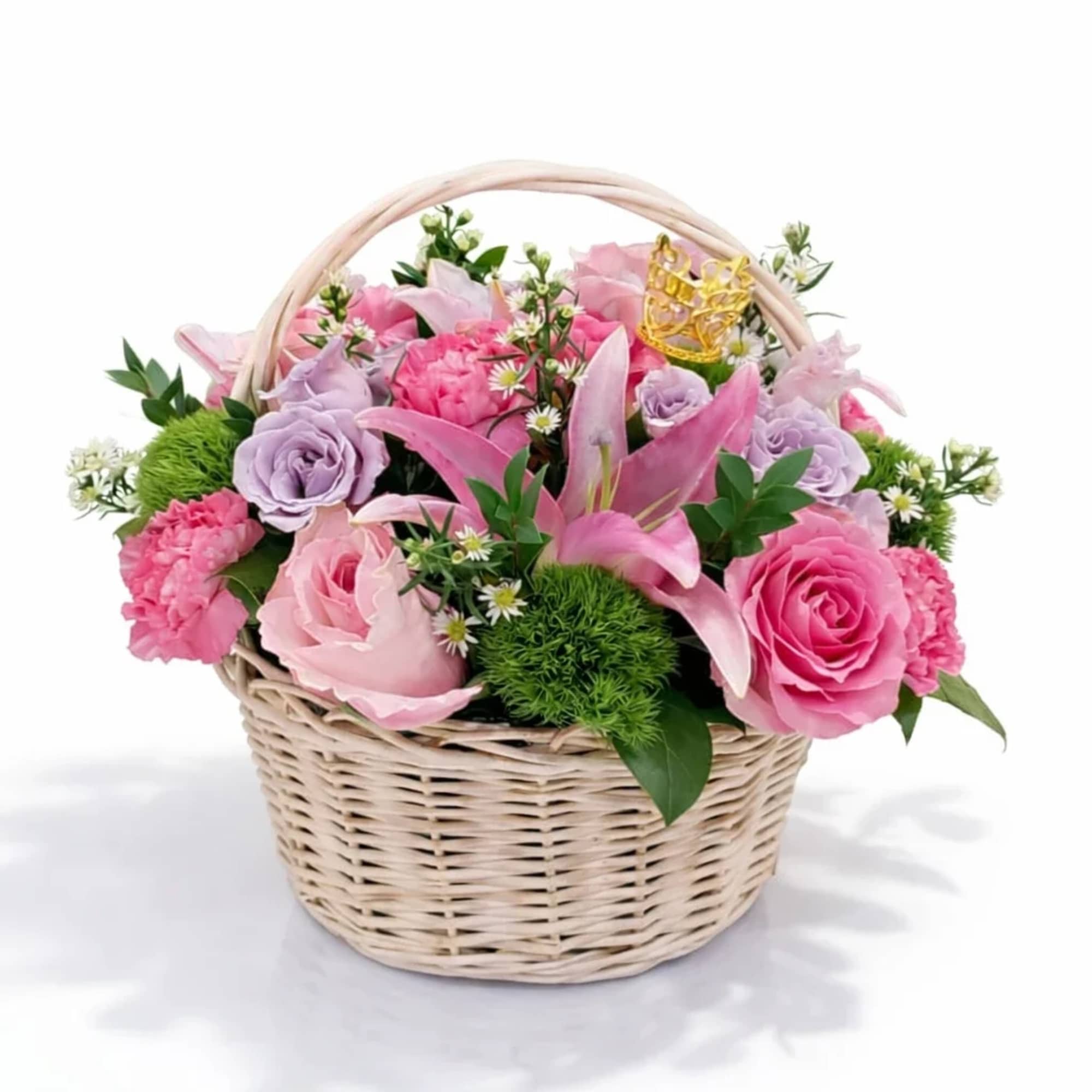 Pink and lavender flowers arranged in a wicker basket, photo 2 of 2