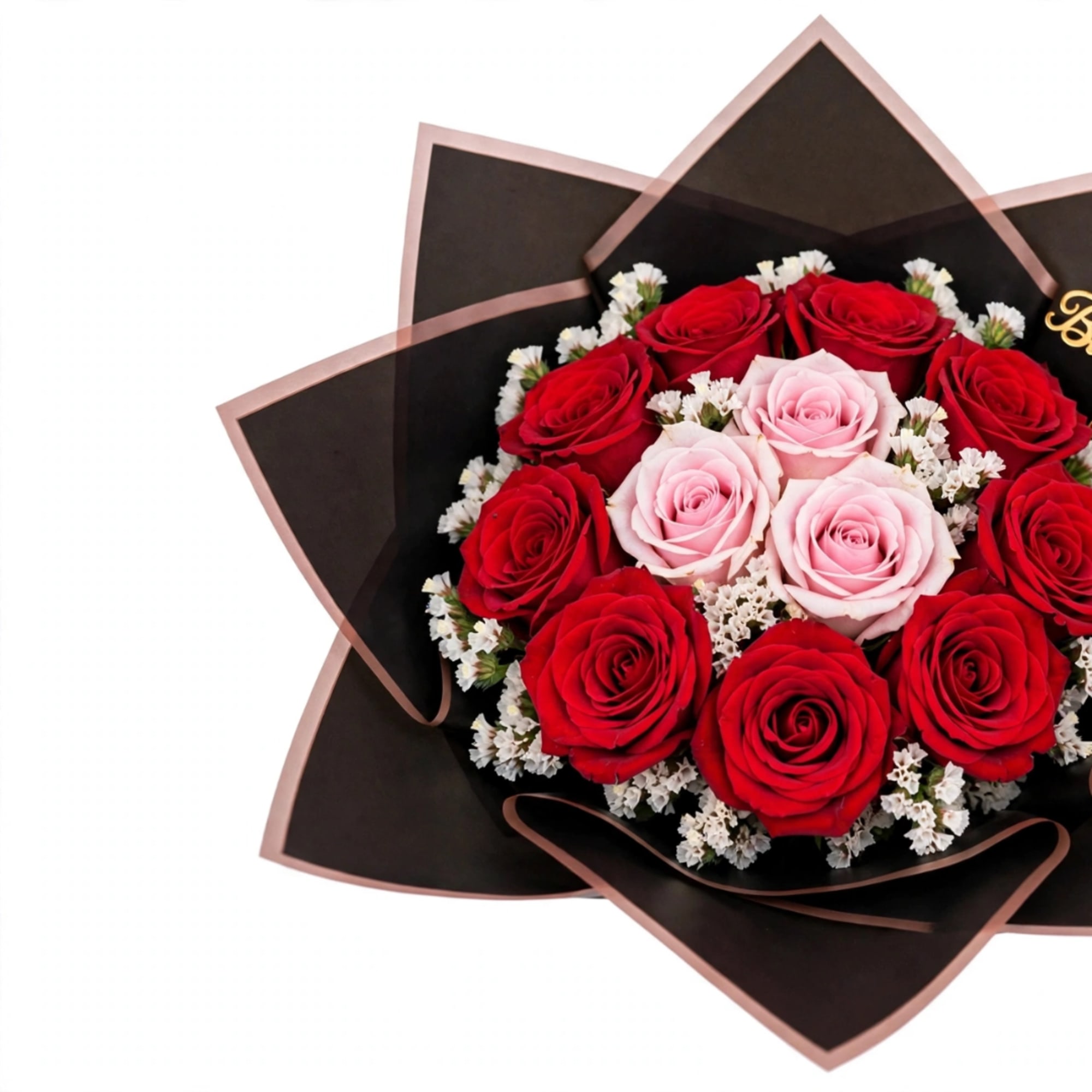 Bouquet of red and pale pink roses wrapped in black paper