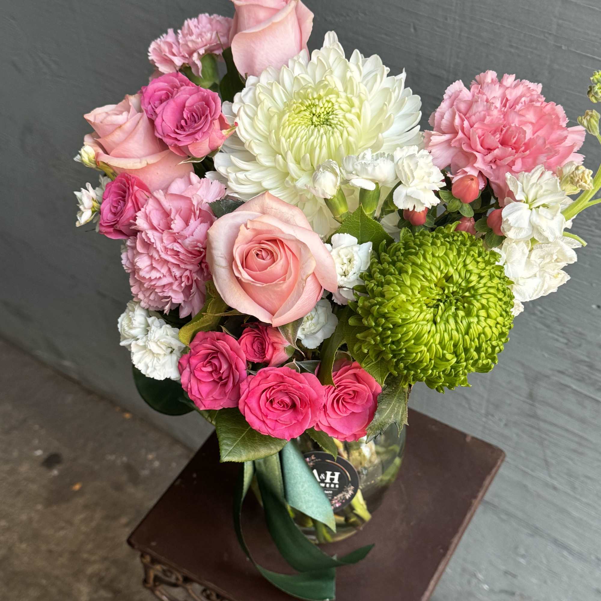 Pink and white mixed bouquet in a glass vase