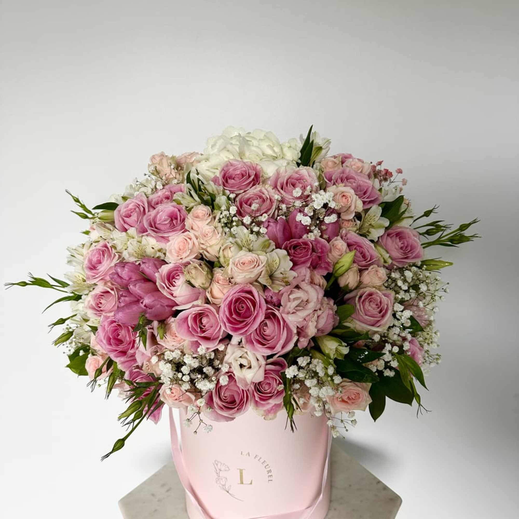 This beautiful arrangement filled with the roses, spray roses, hydrangeas and greens