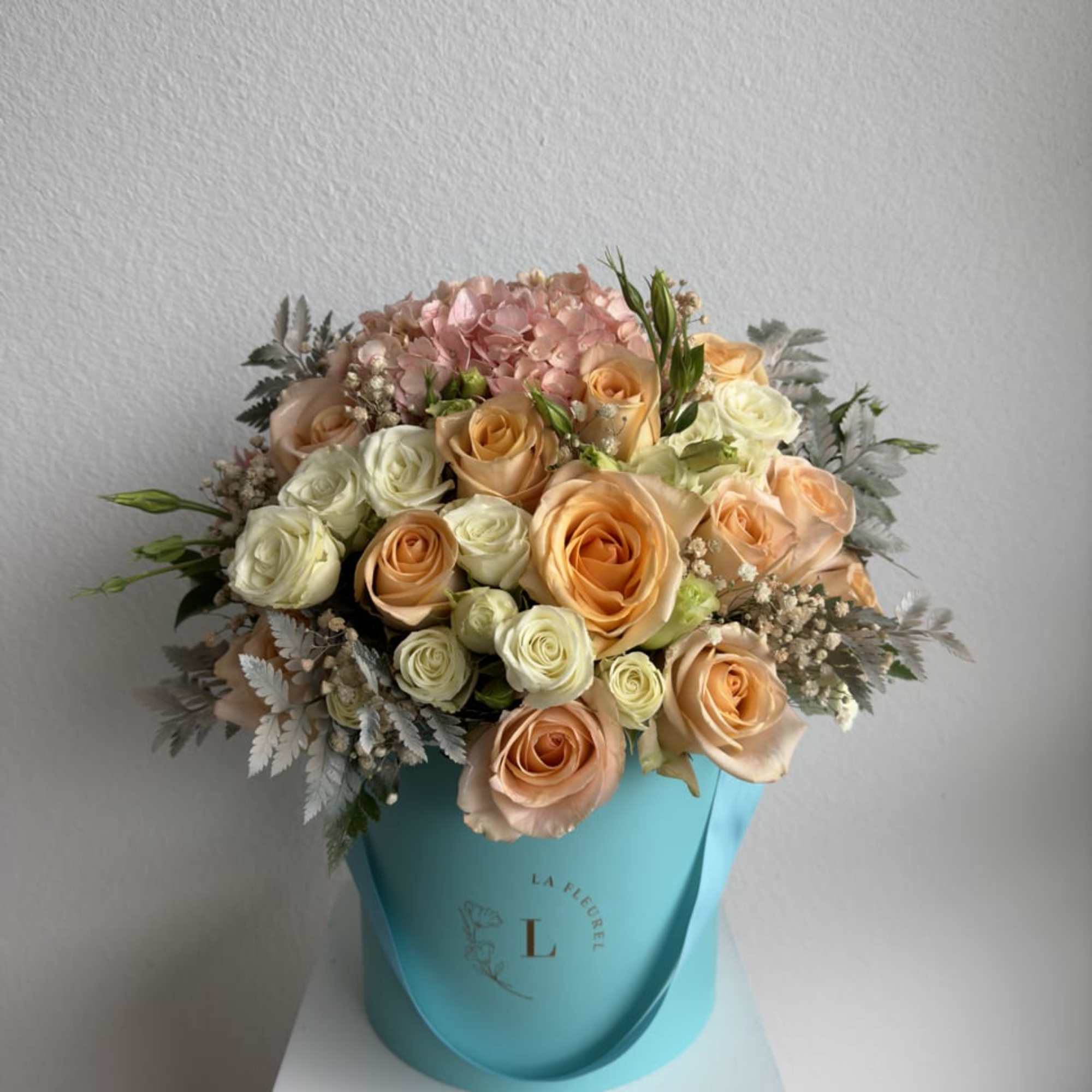 This romantic arrangement includes roses, spray roses and greens.

Perfect for any occasion.
You, photo 2 of 2