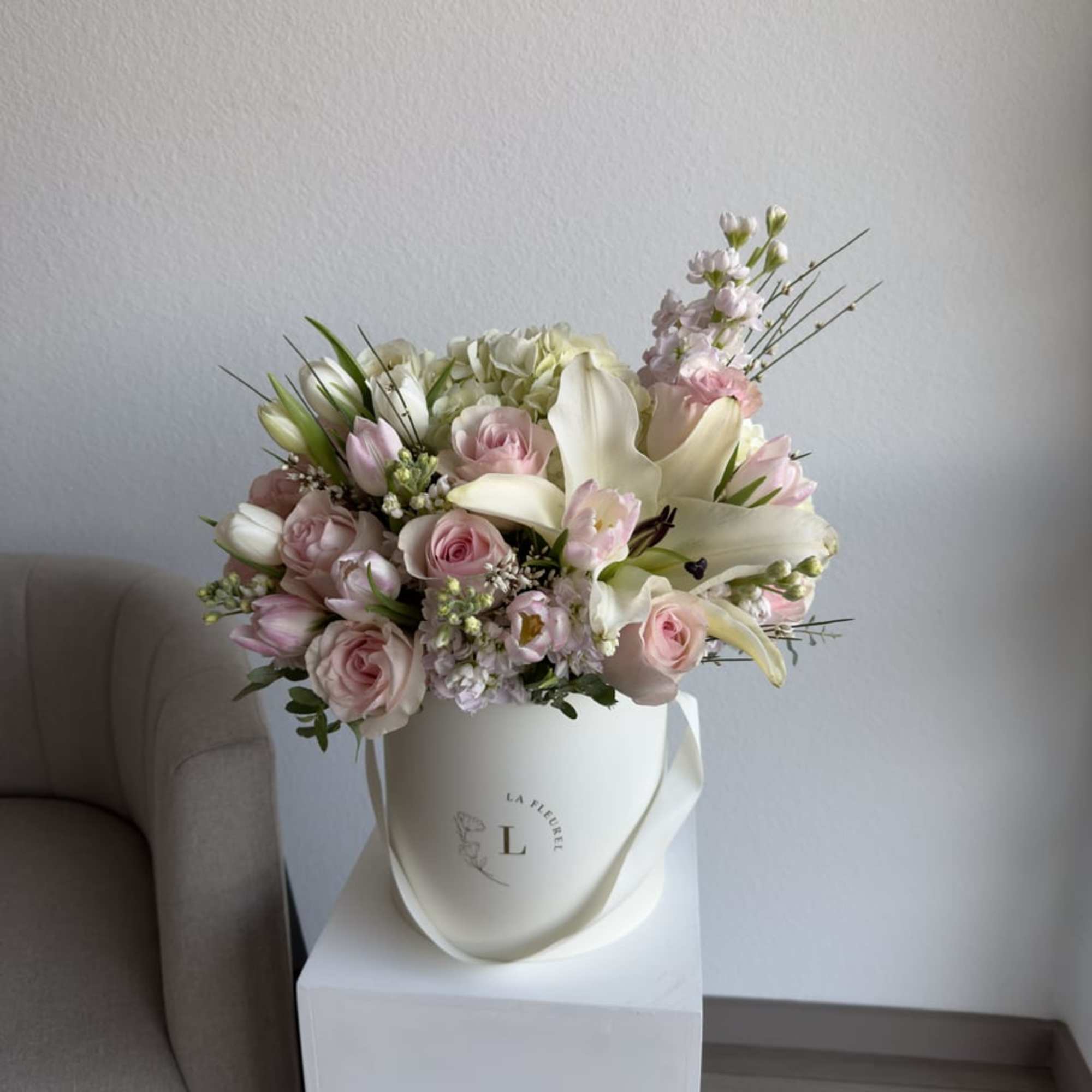 This romantic arrangement includes roses, spray roses, tulips, lilies and greens.

Perfect for, photo 2 of 2