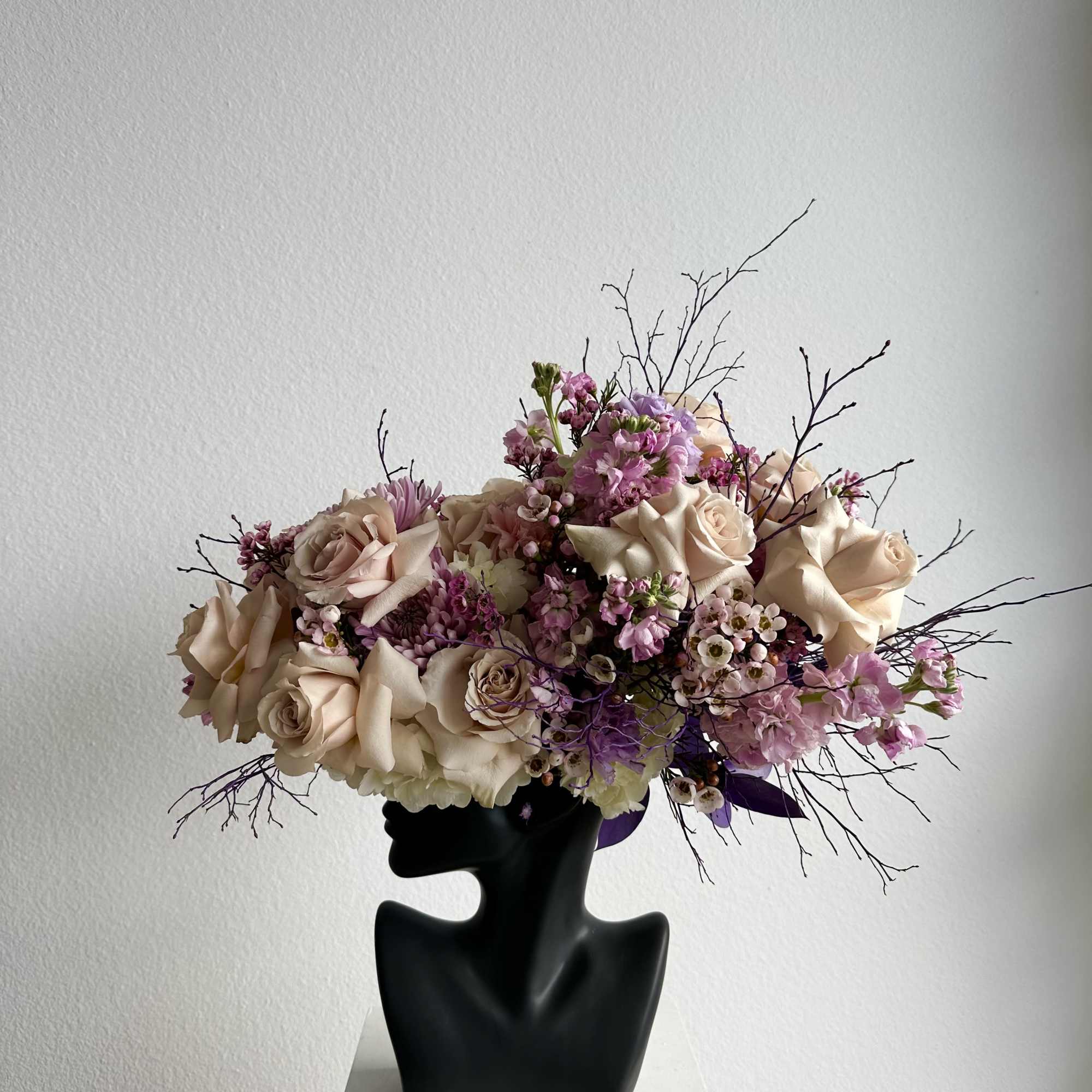 This beautiful arrangement is filled with beige roses, stock and greens to, photo 2 of 2