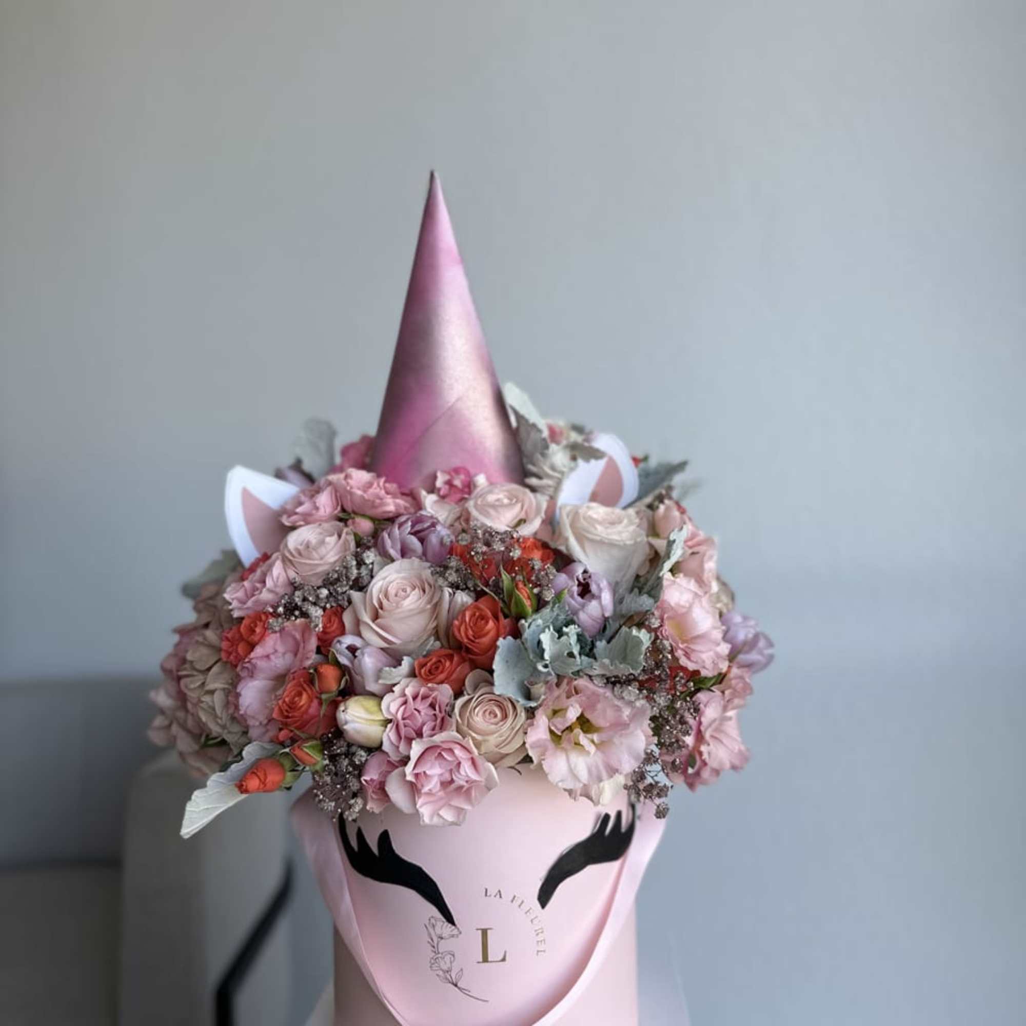 This beautiful box contains a combination of fresh tulips, hydrangeas, greens and