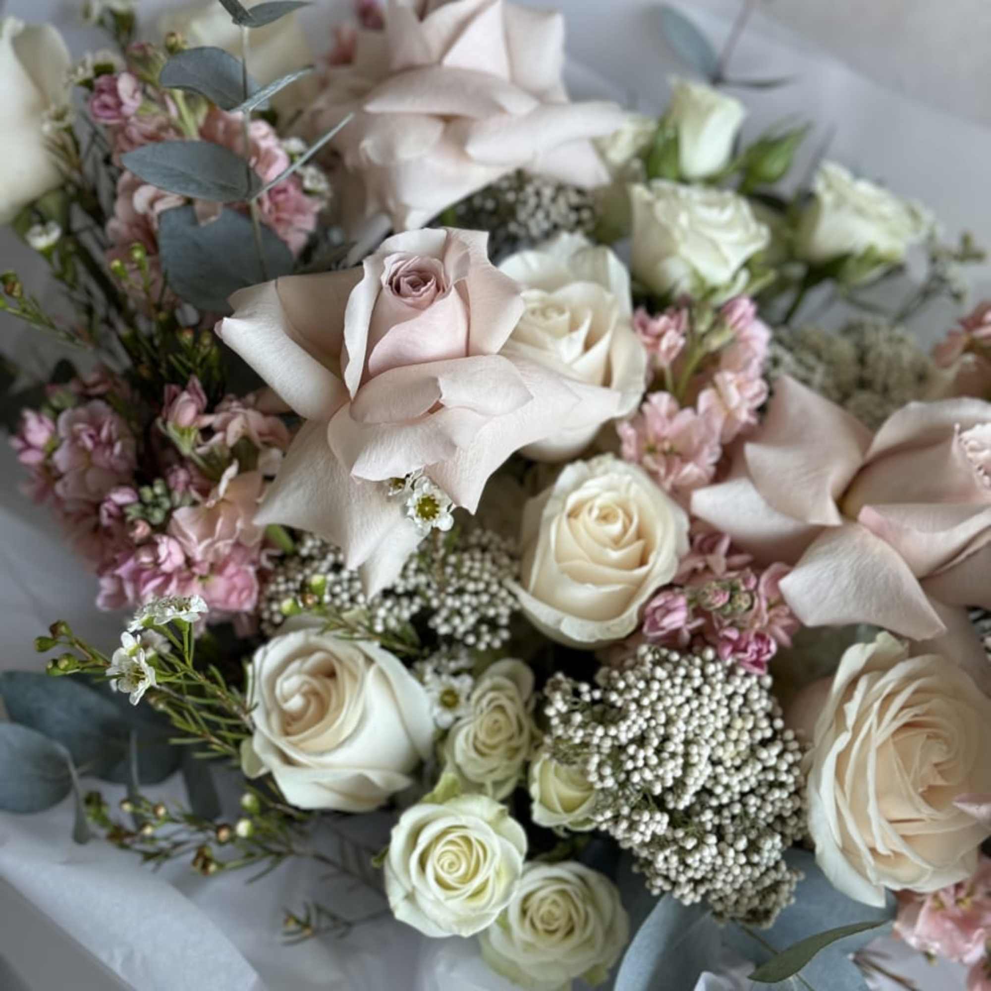 The Charm Bouquet is a delightful handheld arrangement featuring an array of, photo 2 of 2