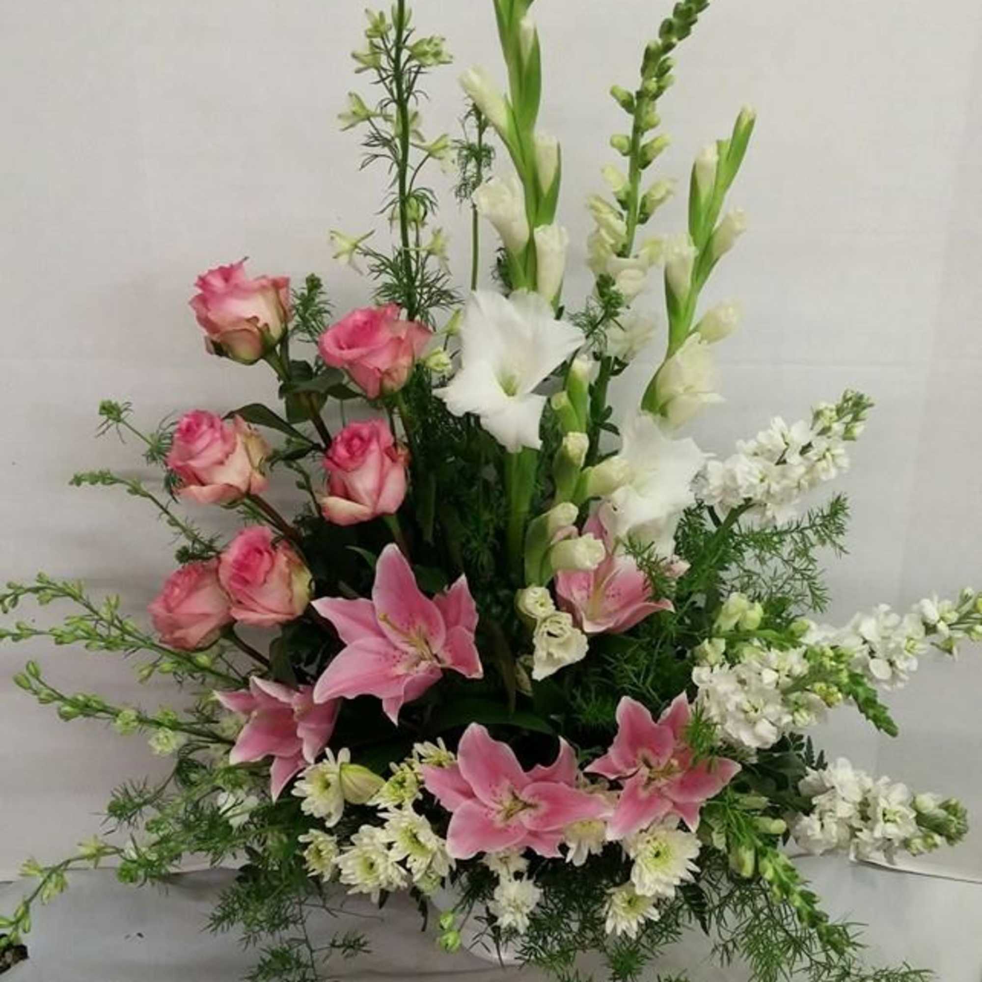 Pastel Funeral basketby Maddy's Old Town Flowers Pastel Funeral basketby Maddy's Old Town Flowers