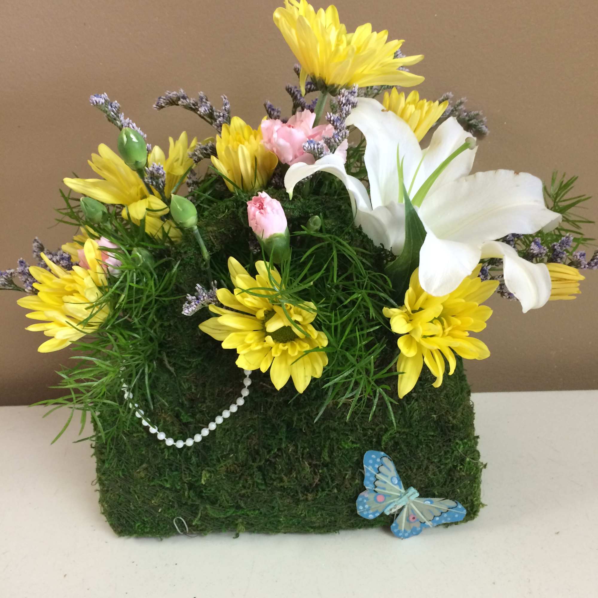 Our designers choice of the freshest flowers in a cute burlap &amp;