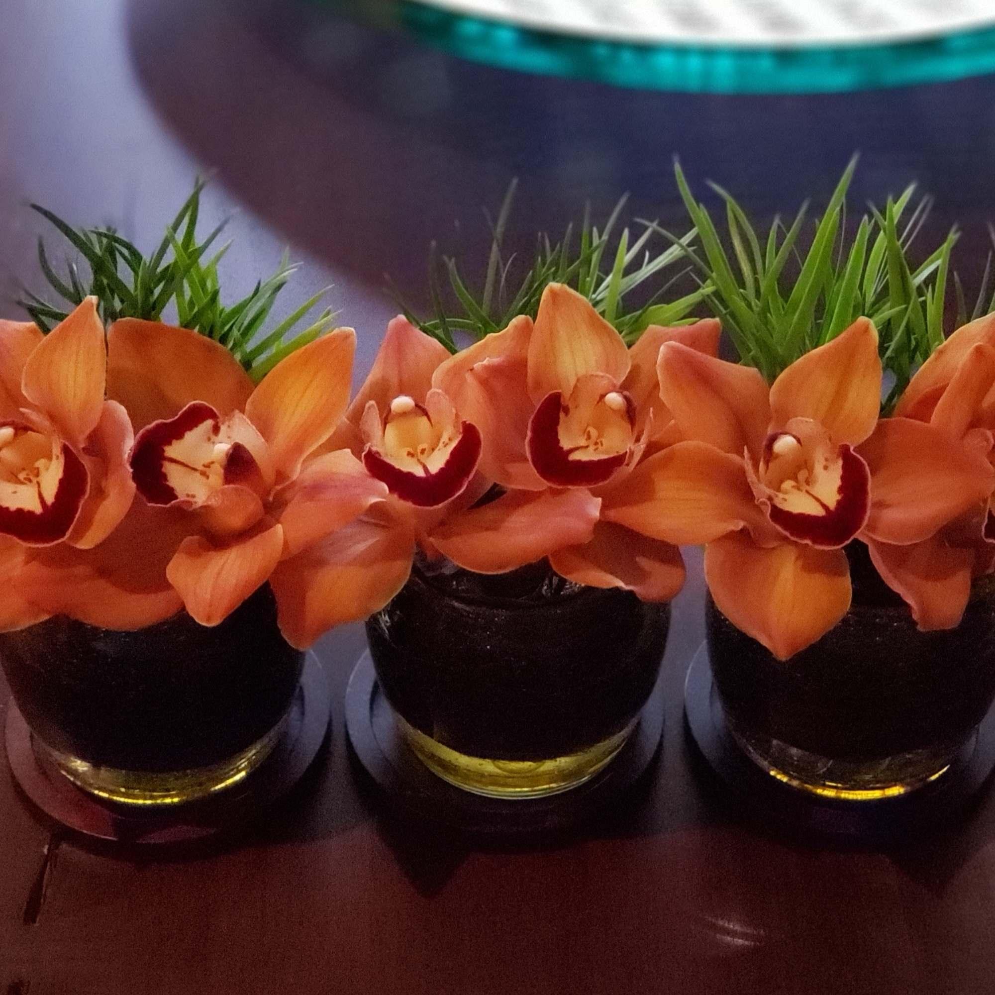 Collection of 3 small floral arrangements in seasonal colors &amp; flowers. 