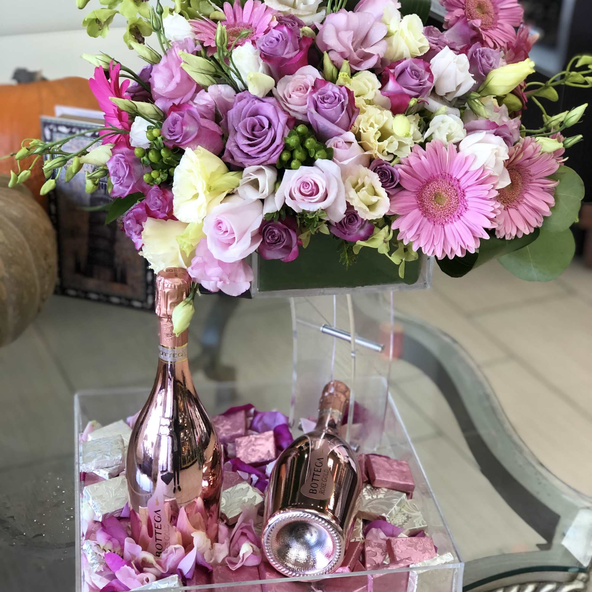 This Chocolato event tray is made with purple daisies, purple roses, spray