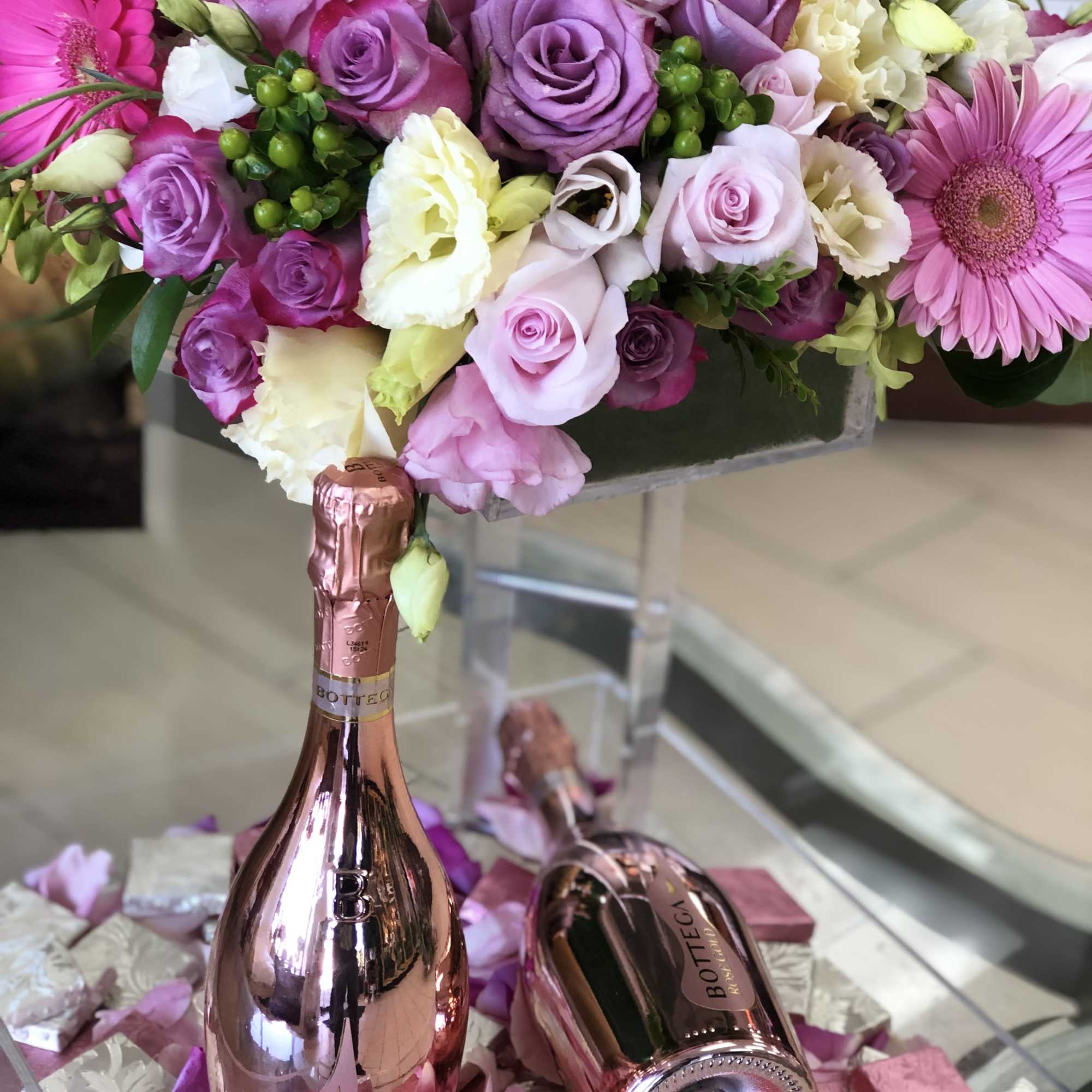 This Chocolato event tray is made with purple daisies, purple roses, spray