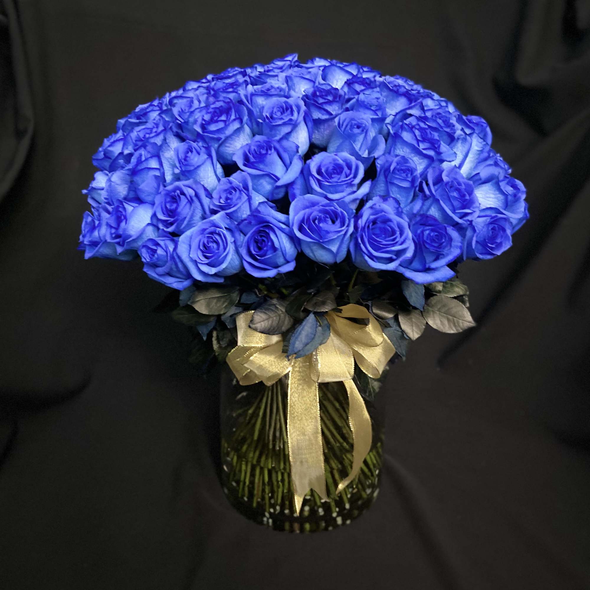 100 Blue Roses in a 12&quot; Glass Cylinder.
