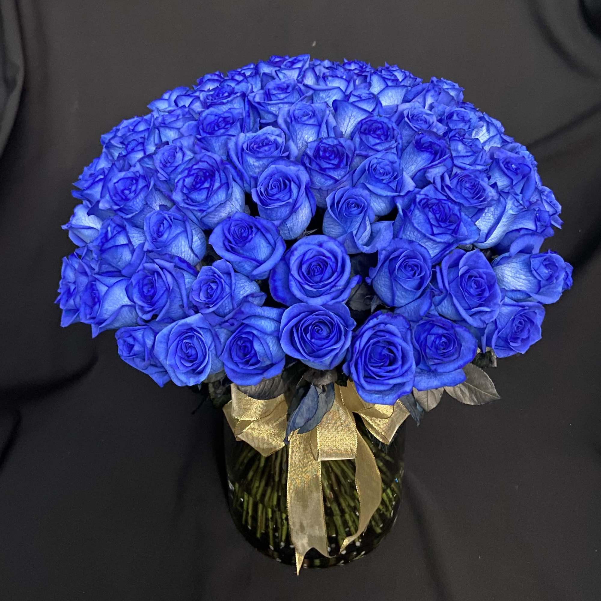 100 Blue Roses in a 12&quot; Glass Cylinder.
