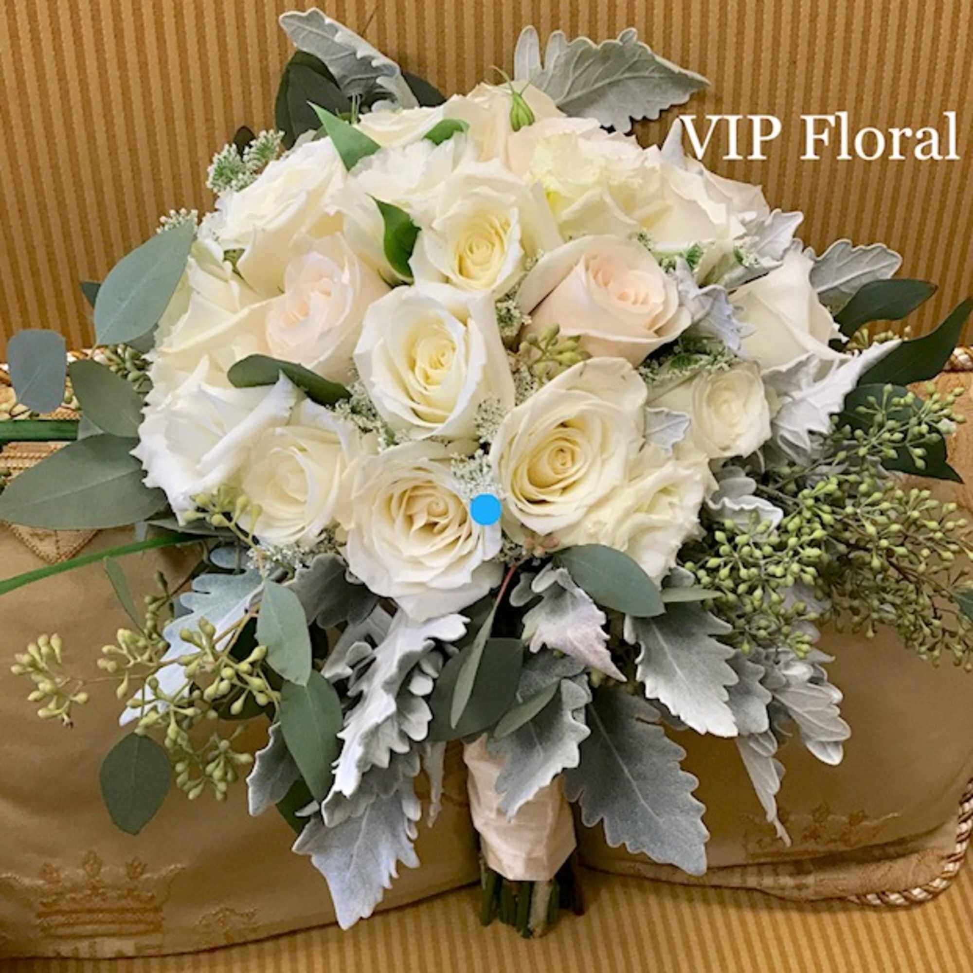 BRIDAL BOUQUET
White and Cream Roses, seeded Eucalyptus, Dusty Miller.
