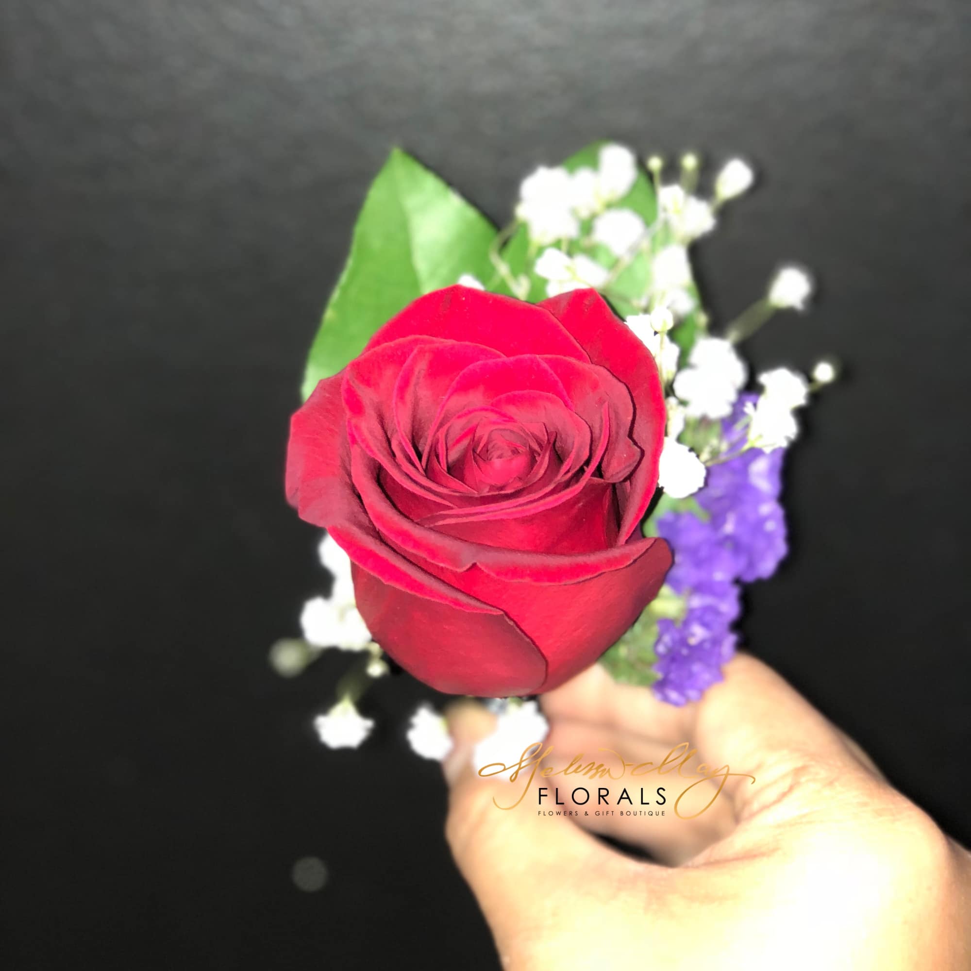 A red rose with babies breath or request any color. It is