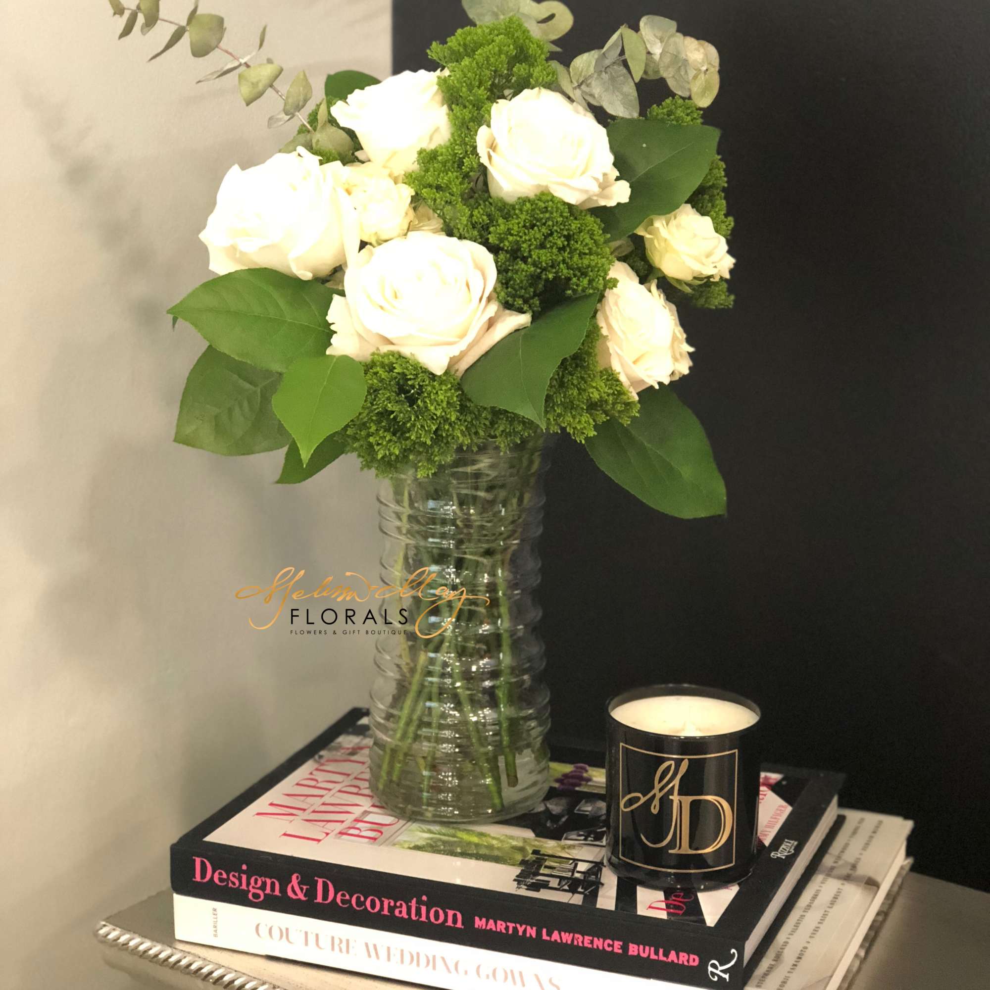 Picking up an arrangement of all white roses is always the best