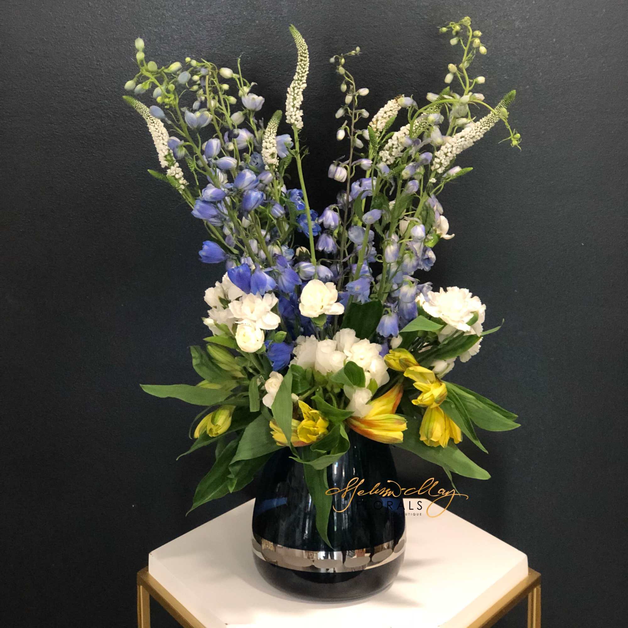 With a touch of the alstroemerias and blue flowers to bring together