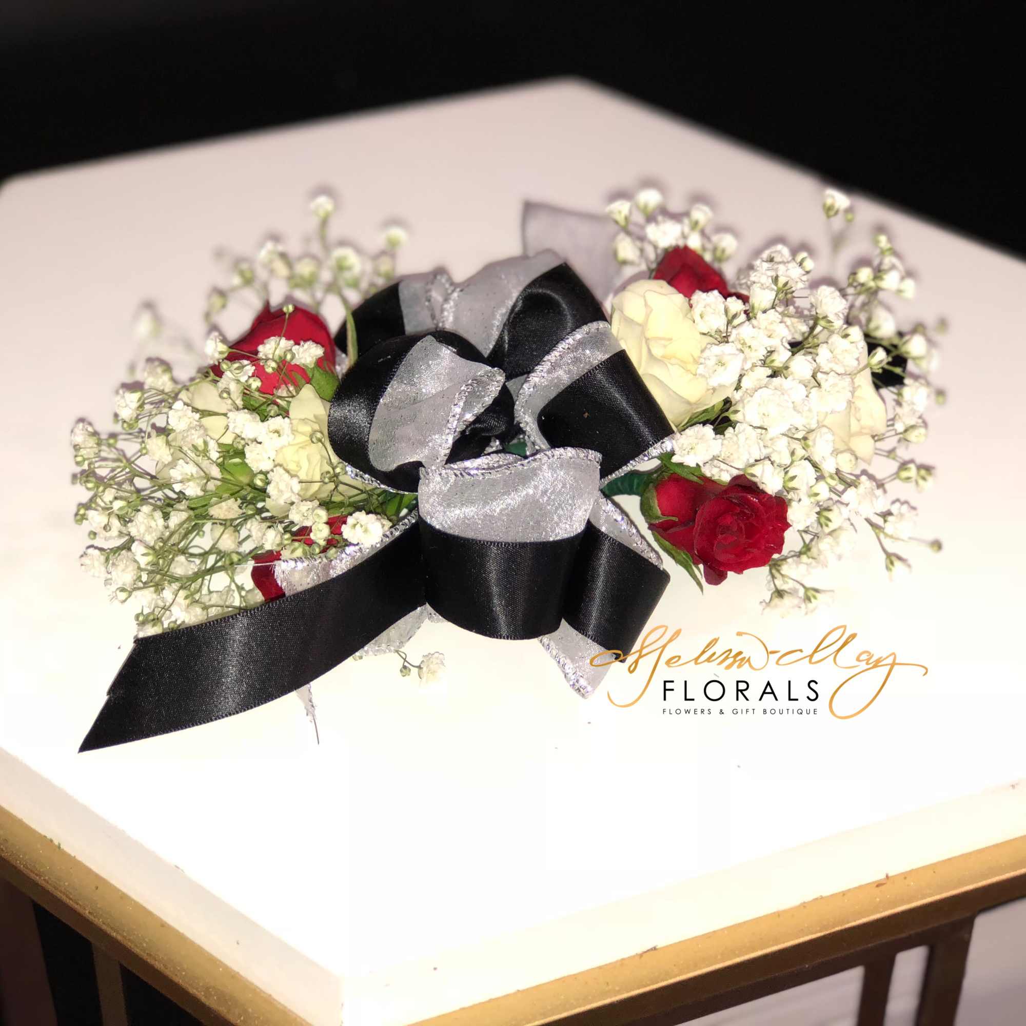 The perfect corsage for a prom date . It has black and