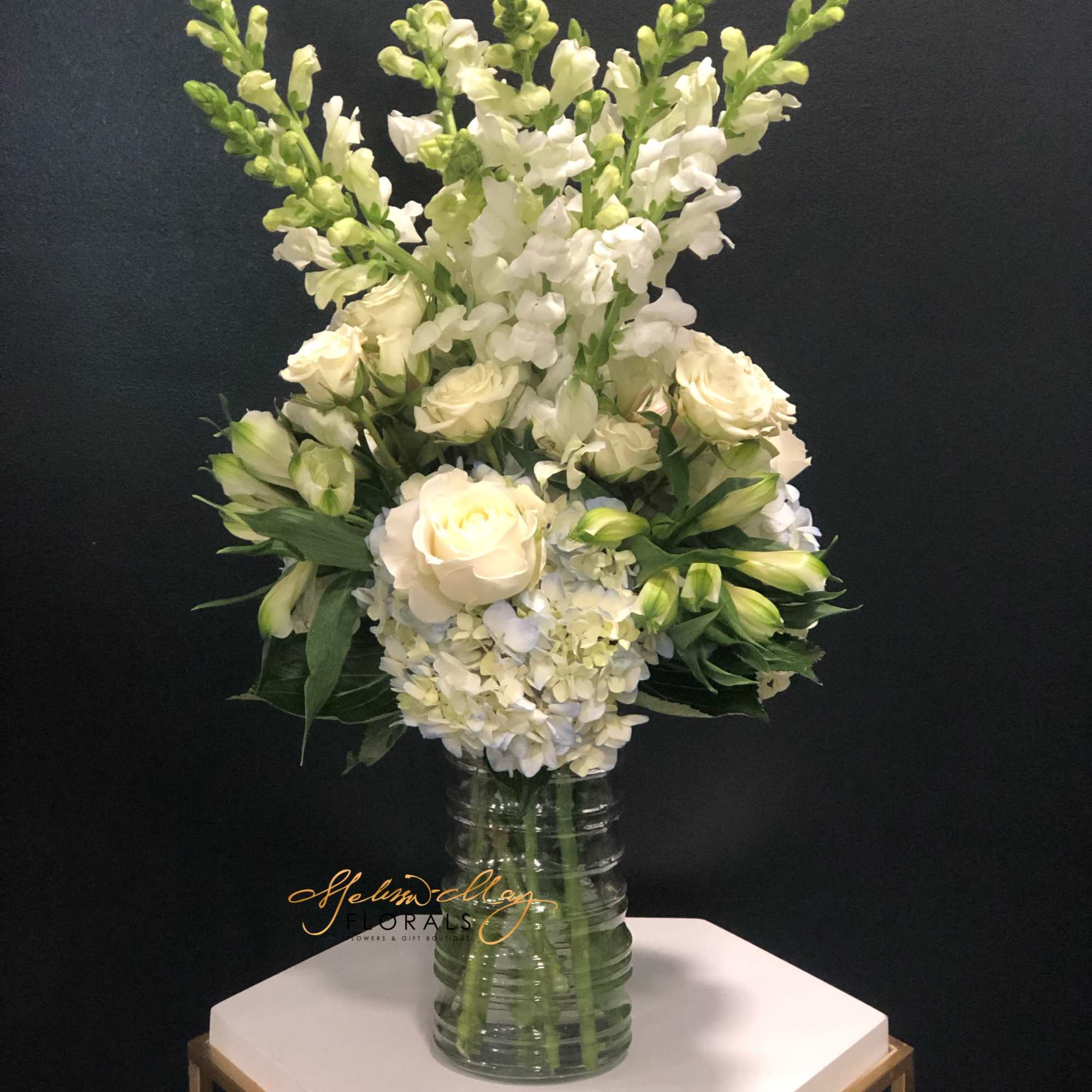 This gorgeous soft-toned arrangement will bring back wishful feelings of magical days