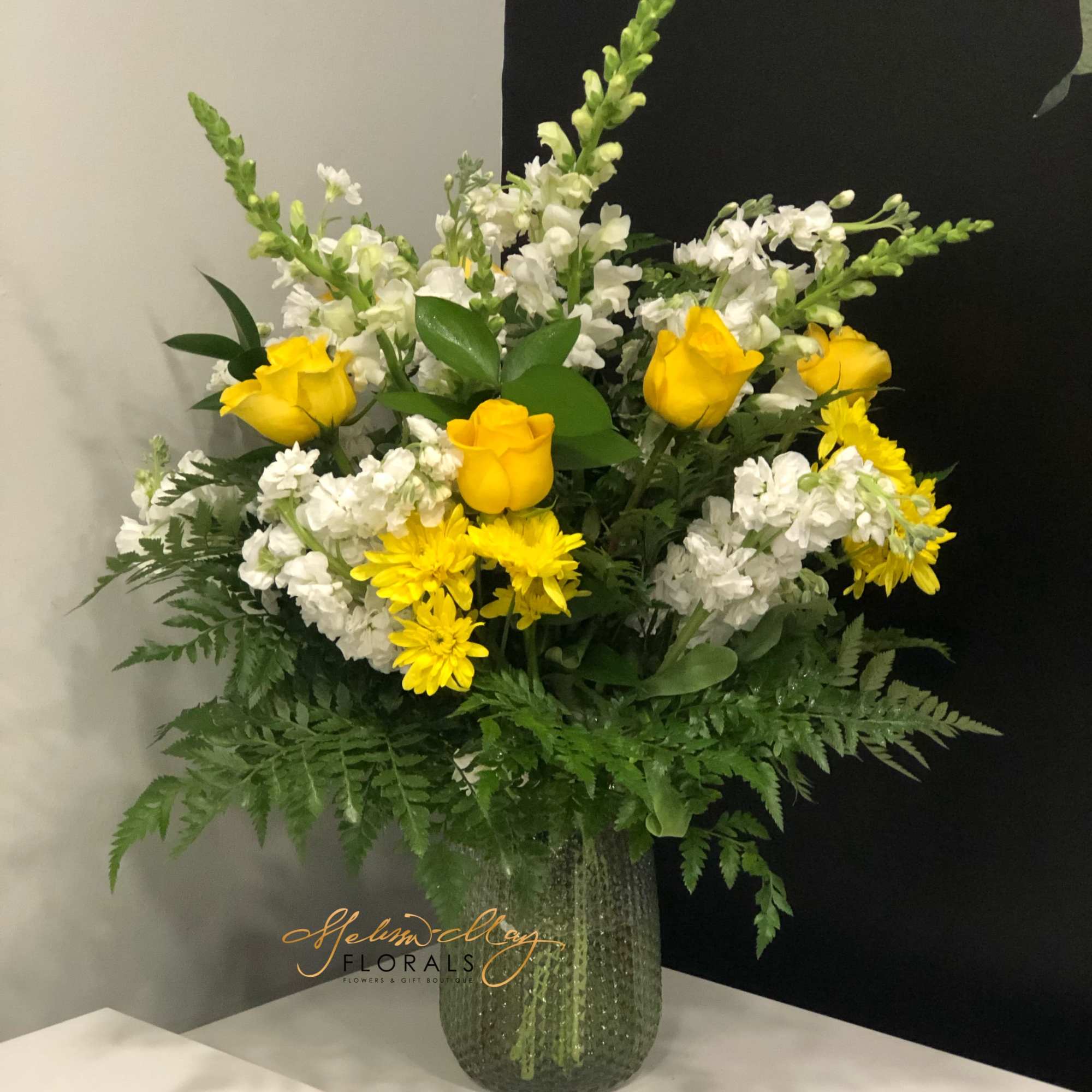 This is for the sunshine of your life. This arrangement has Bright