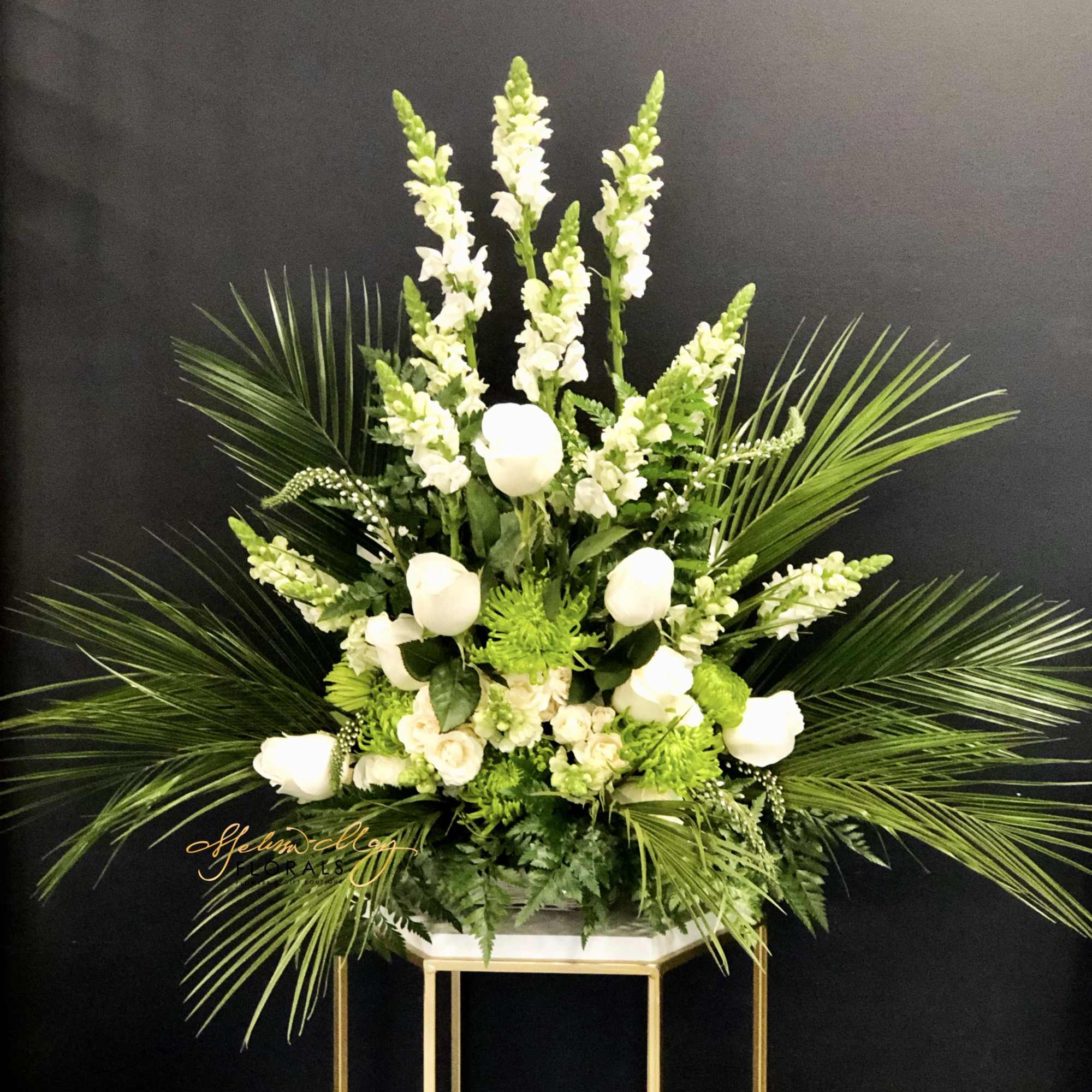 This beautiful vibrant arrangement will honor your loved one. This arrangement has