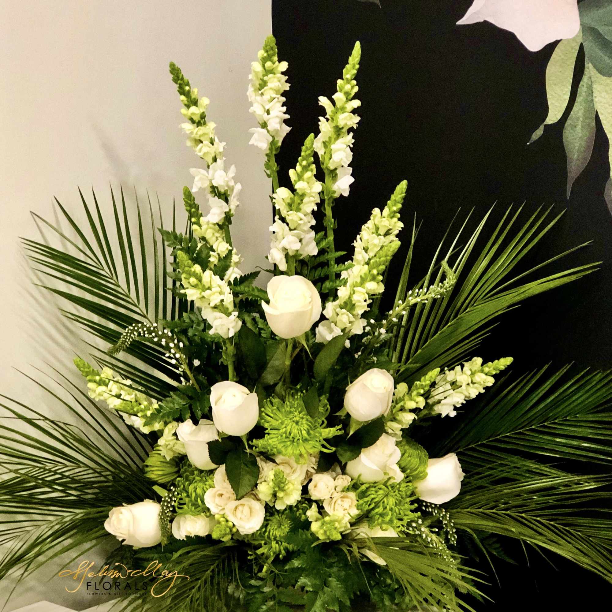 This beautiful vibrant arrangement will honor your loved one. This arrangement has