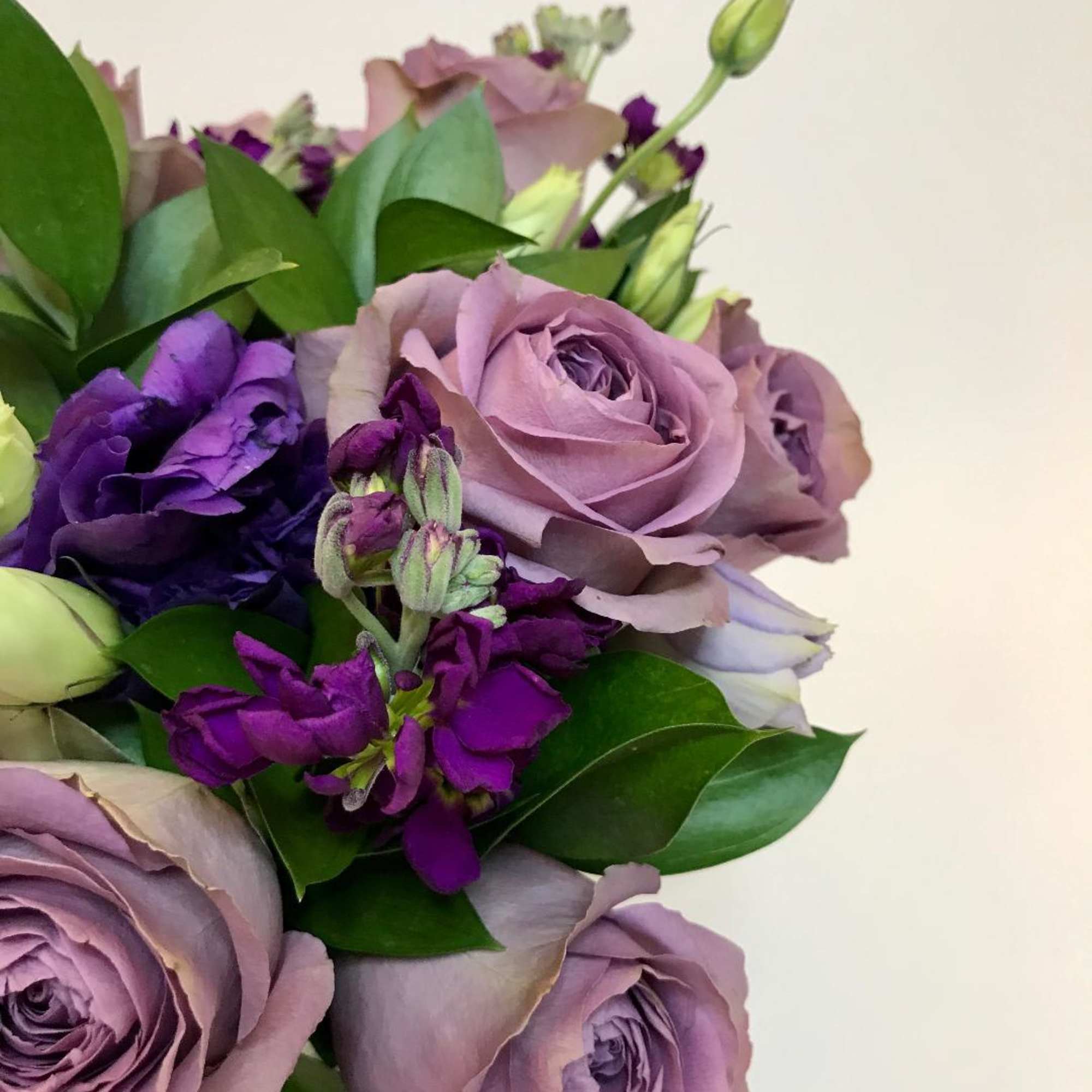 For the person that loves purple:  purple roses, purple lisianthus, stock