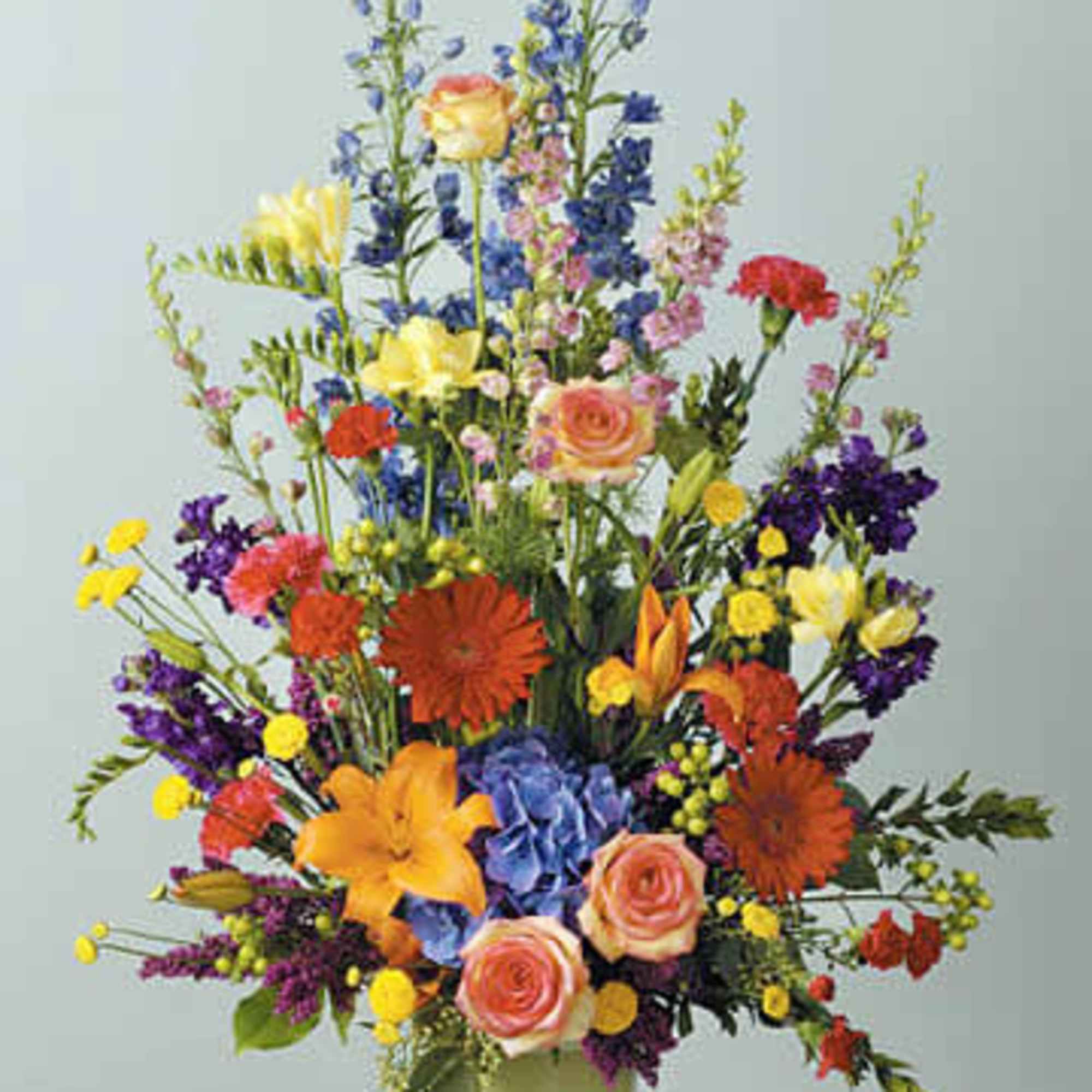 Lilies, mini Carnations, gerber daisies, hydrangea freesia carnations, stock, heather, larkspur, hypericum