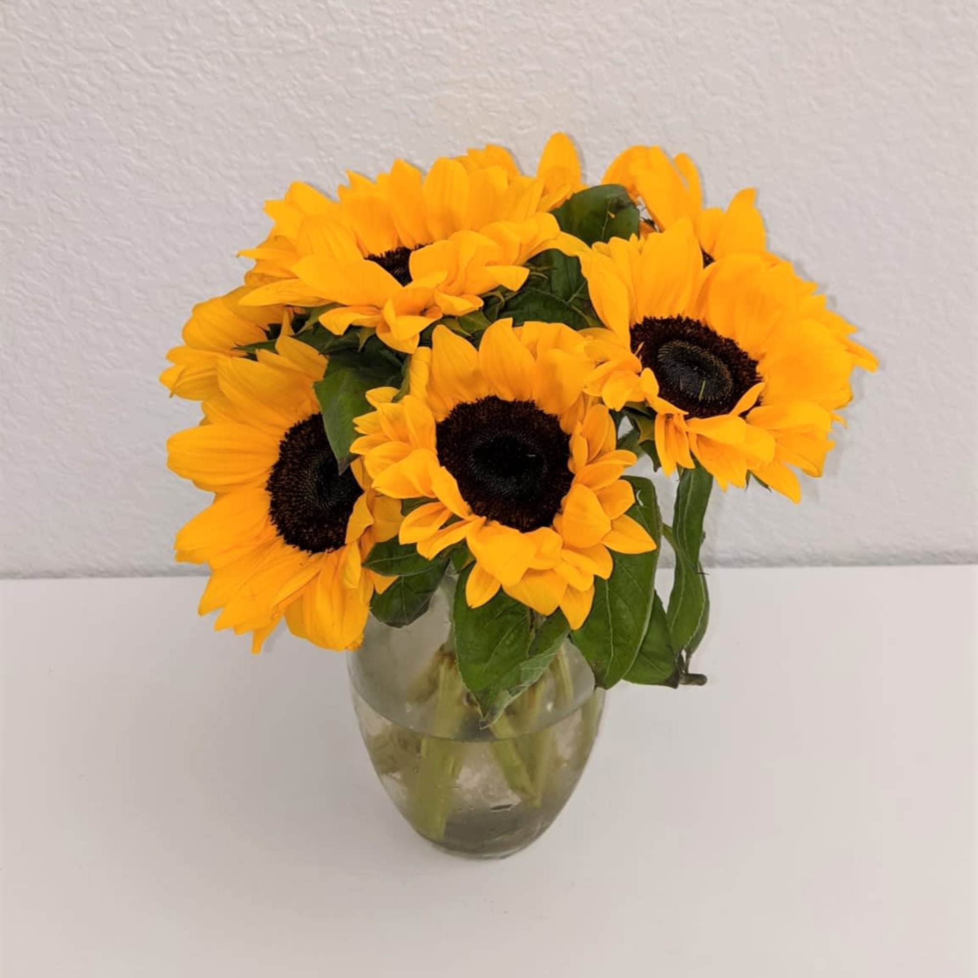 A delightful bunch of fresh sunflowers to brighten up your day! Perfect