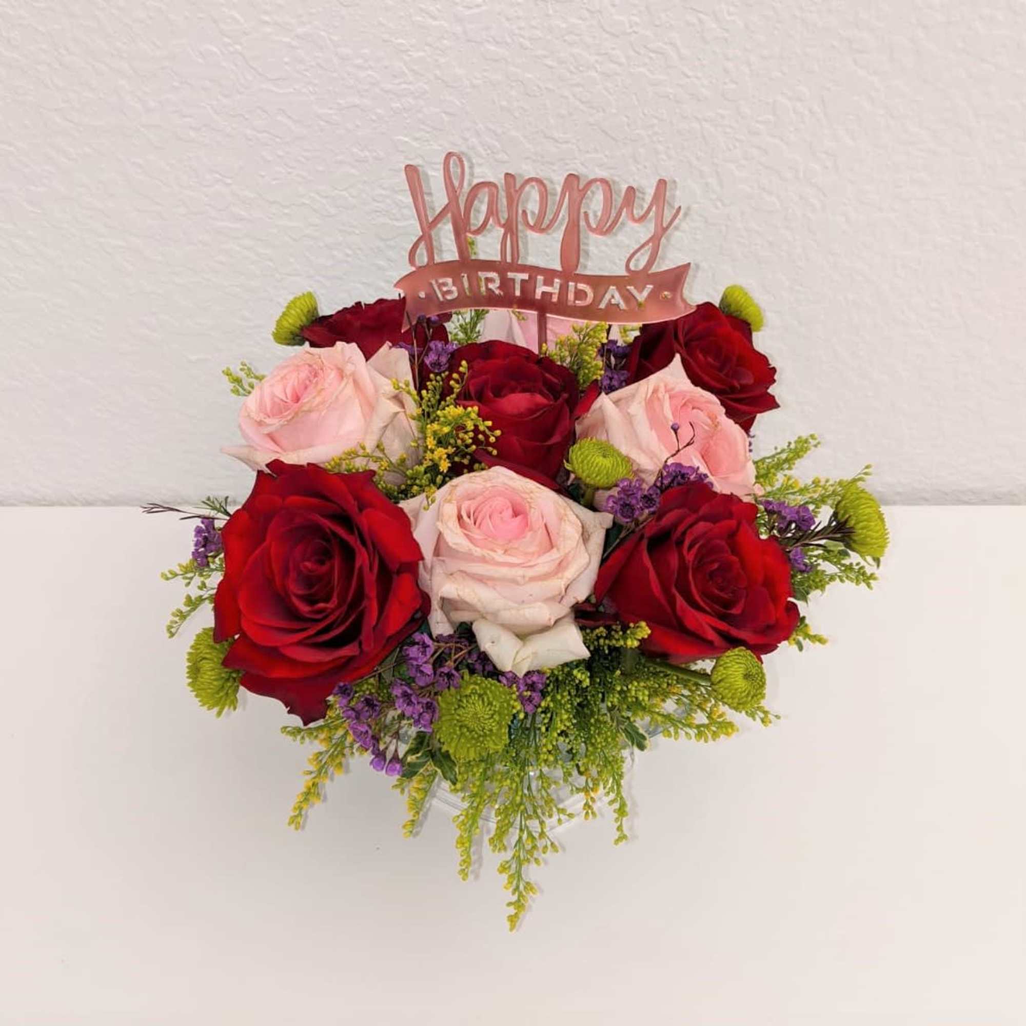 A beautiful mid sized cup filled with various fresh flowers! Great for