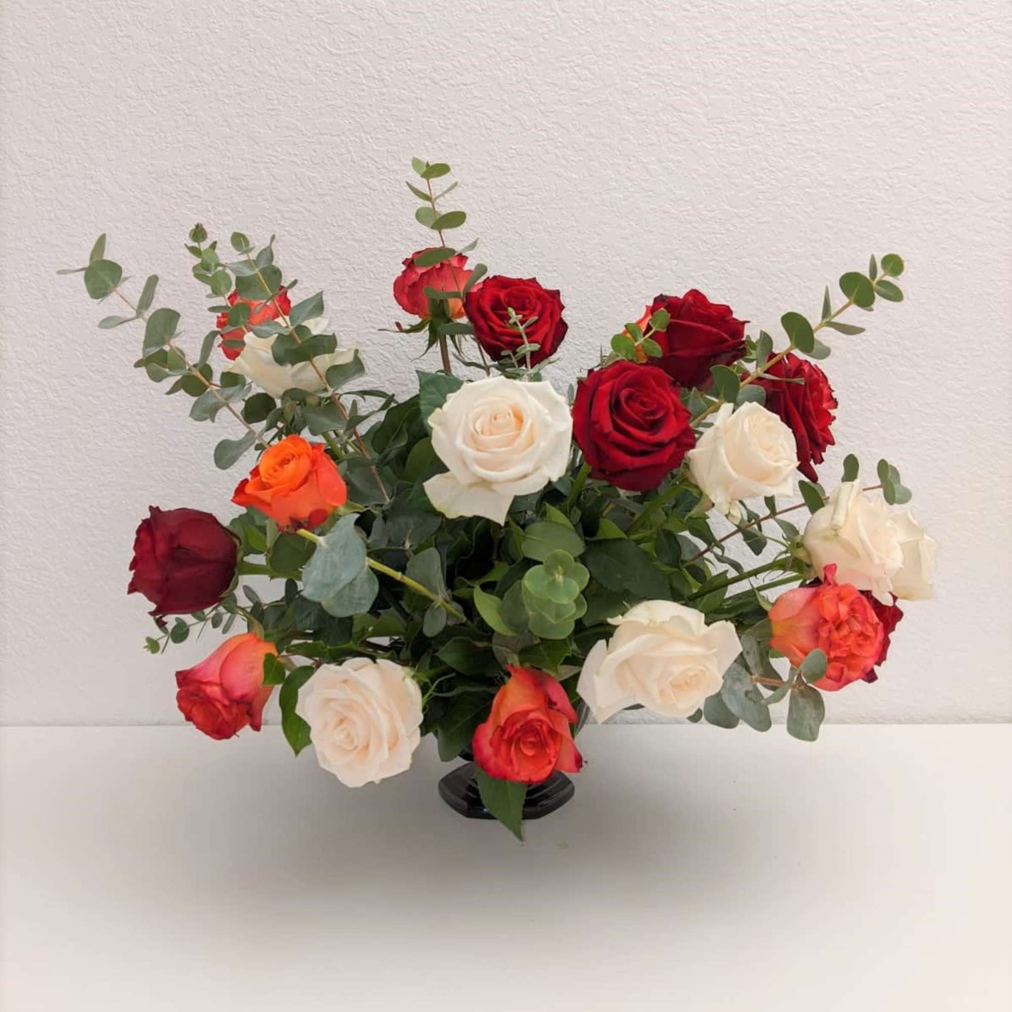 A premium mix of roses and fresh eucalyptus. Perfect to display for