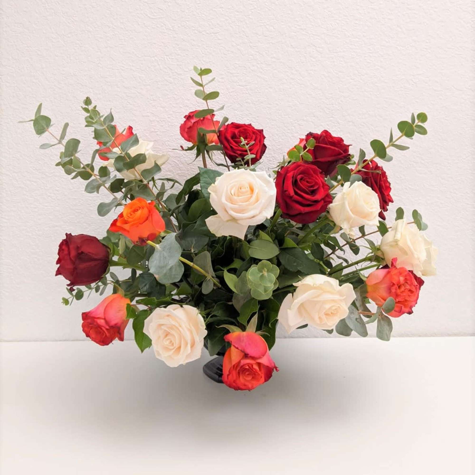 A premium mix of roses and fresh eucalyptus. Perfect to display for