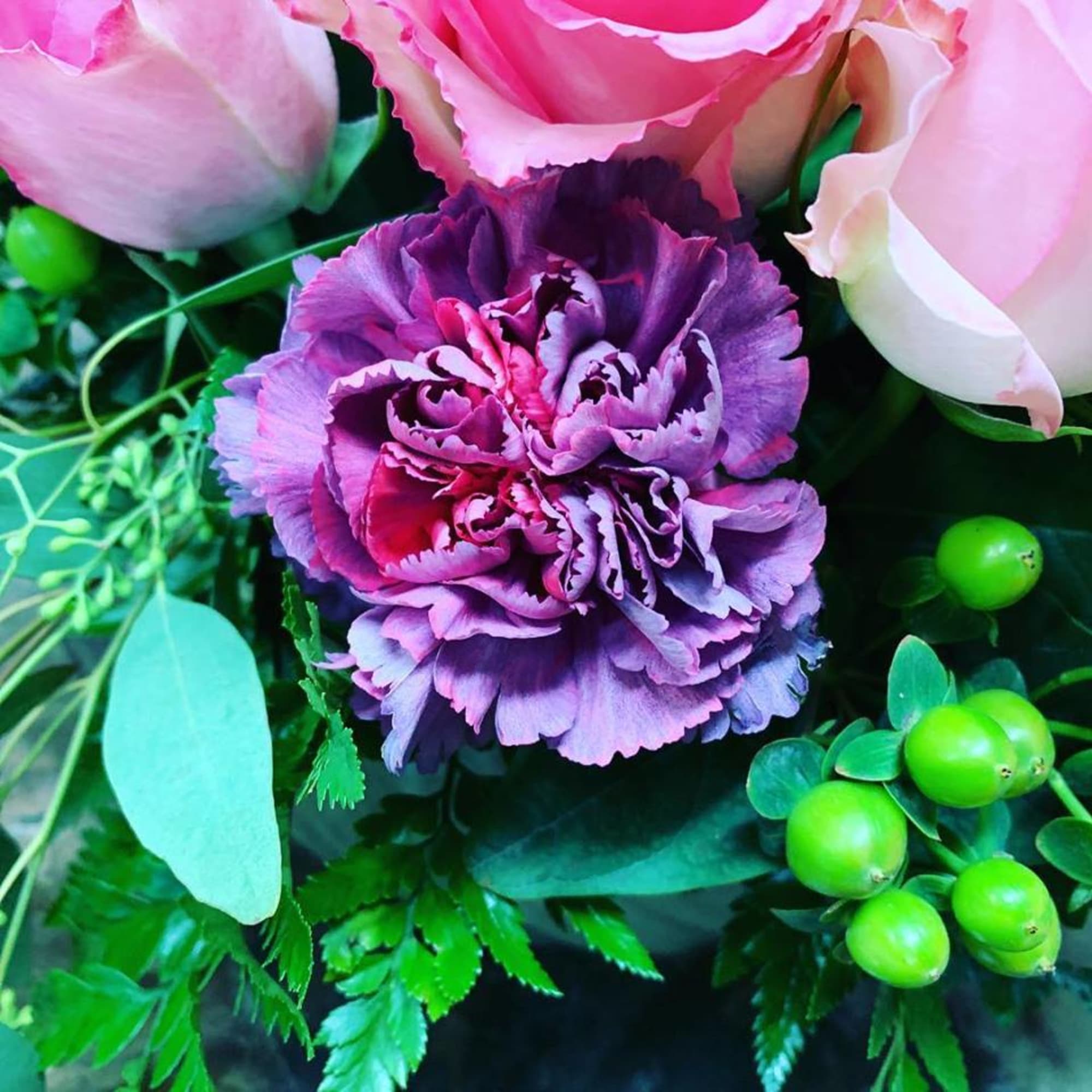 This arrangement is made in a short glazed ceramic container with White This arrangement is made in a short glazed ceramic container with White