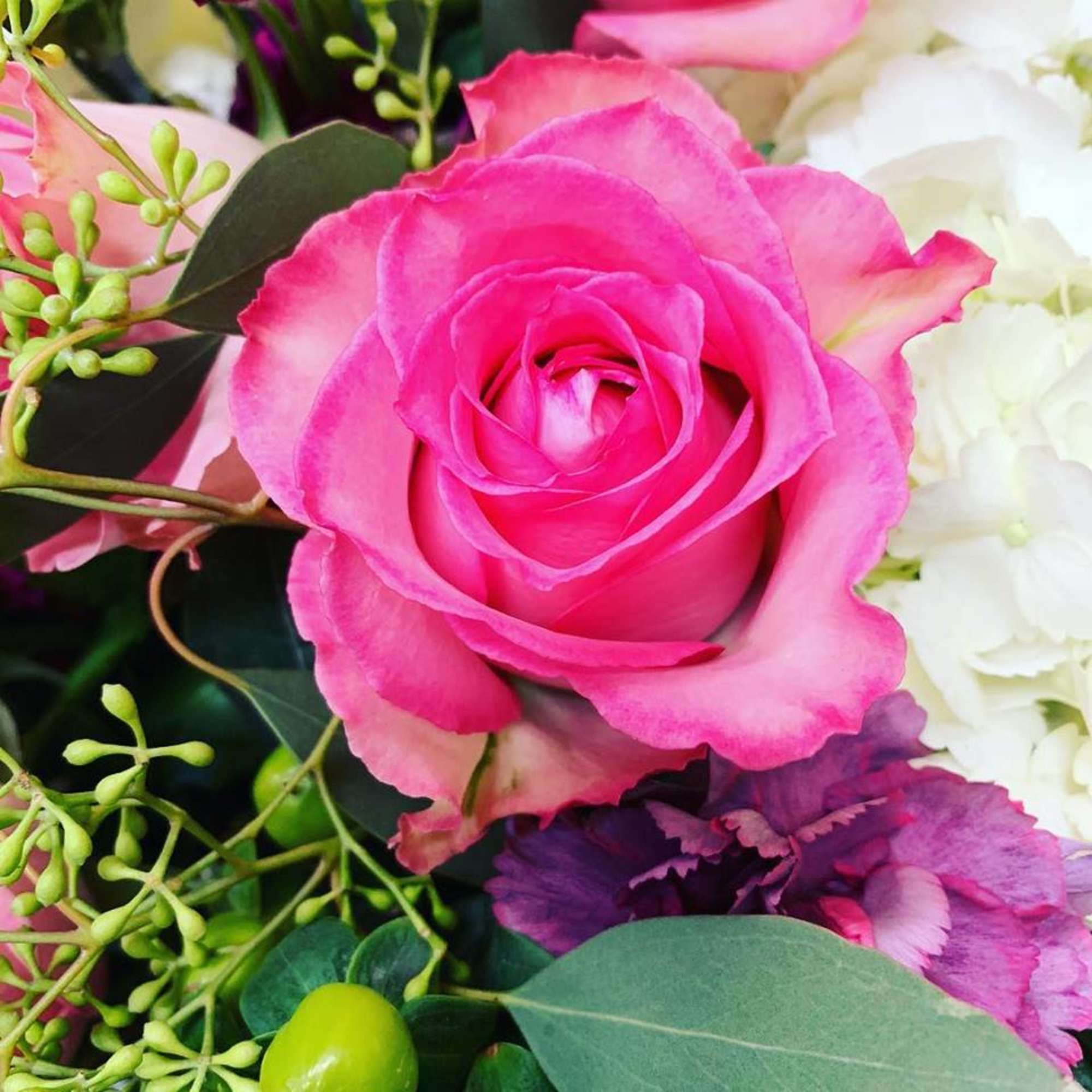 This arrangement is made in a short glazed ceramic container with White This arrangement is made in a short glazed ceramic container with White