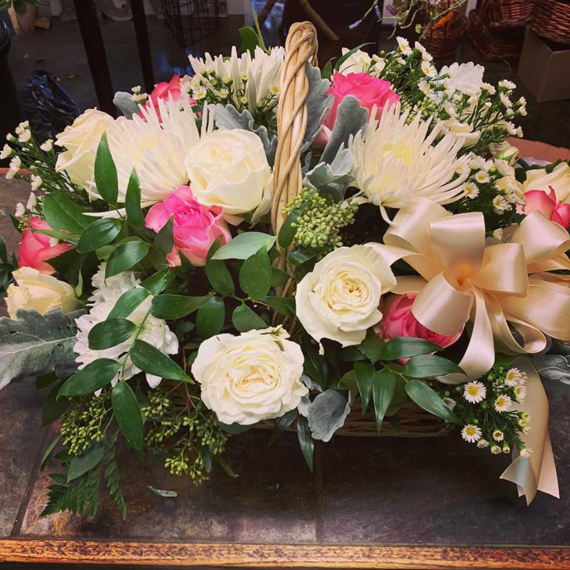This Basket Spray has White Roses, Creme Spray Roses, Pink Roses, White