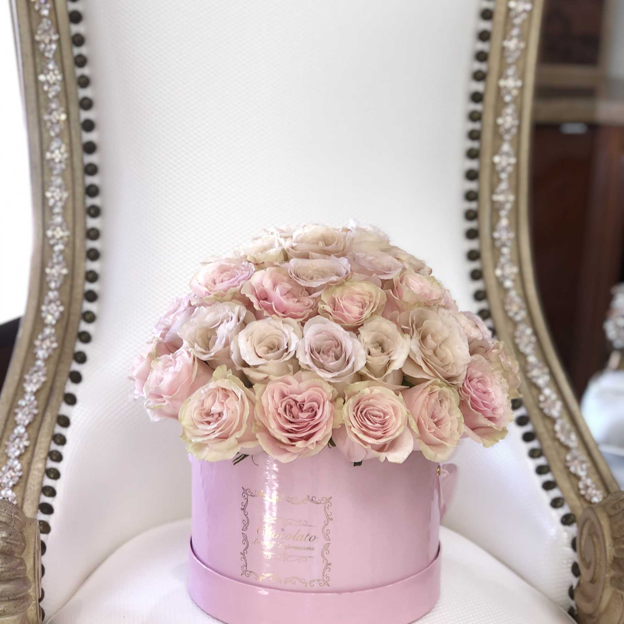 This Chocolato arrangement is made with Pink Roses. The arrangement comes in