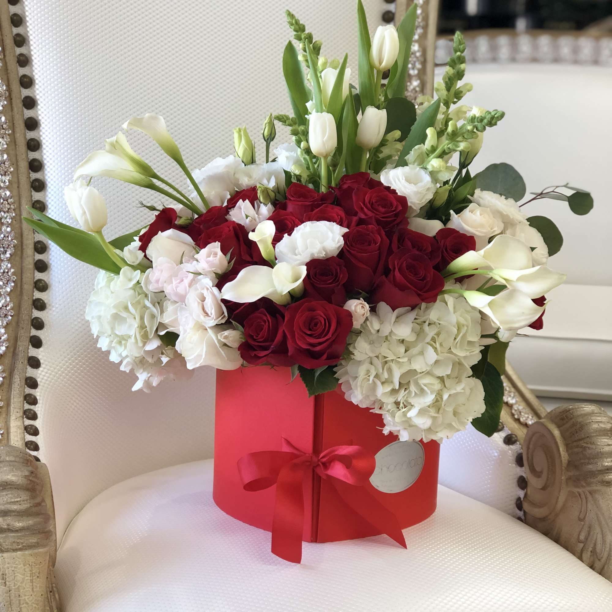 This Chocolato arrangement is made with White Tulips, Red and White Roses