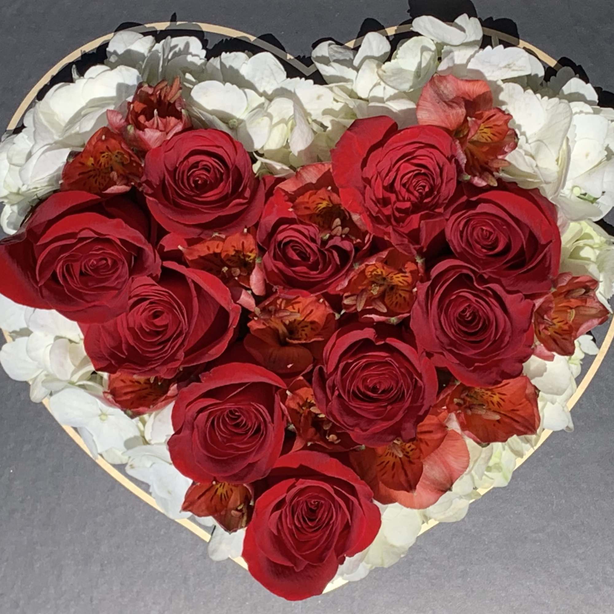 Say I love you with this package of red roses, alstroemeria and