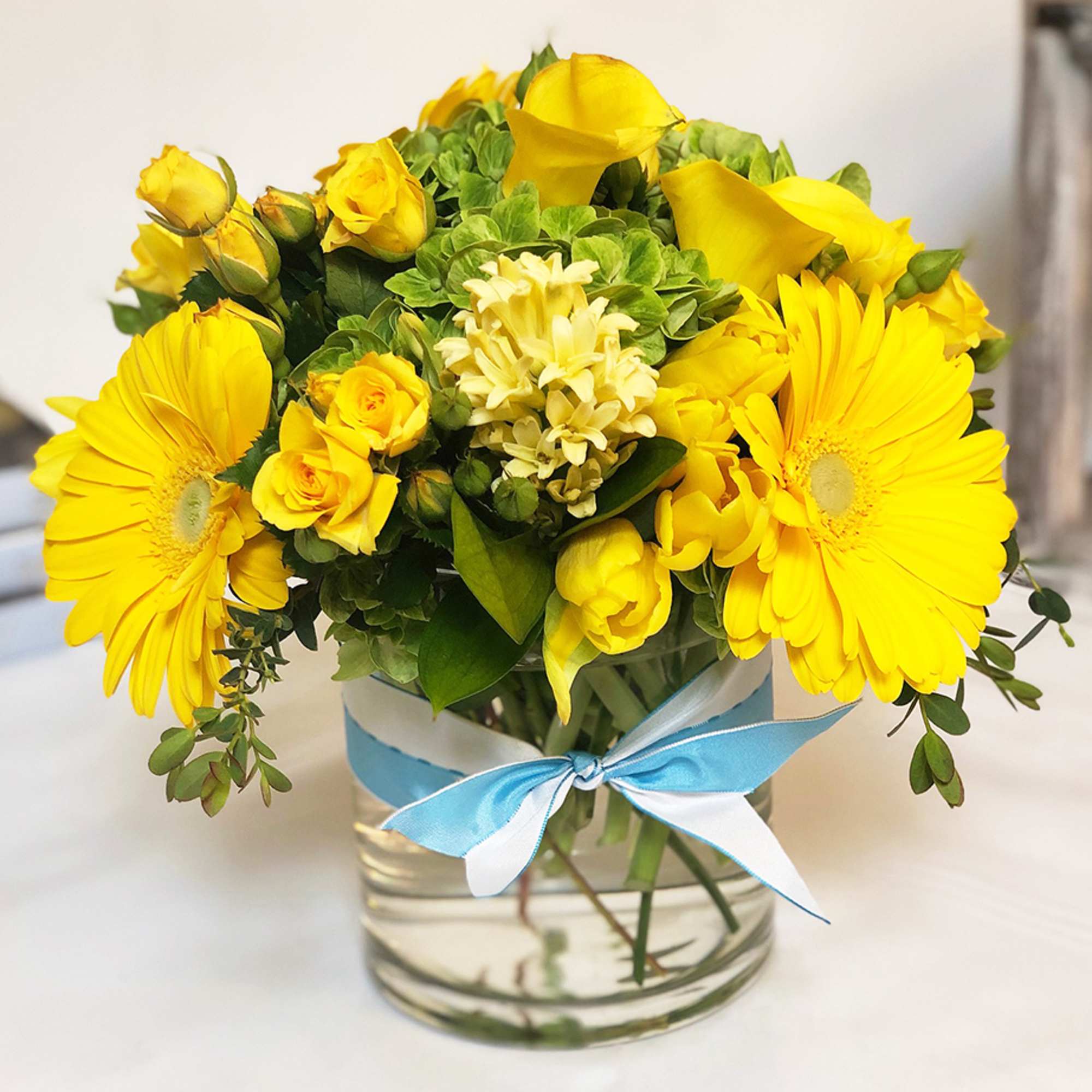 The perfect arrangement for that sunny person in your life. Tulips, Ranunculus