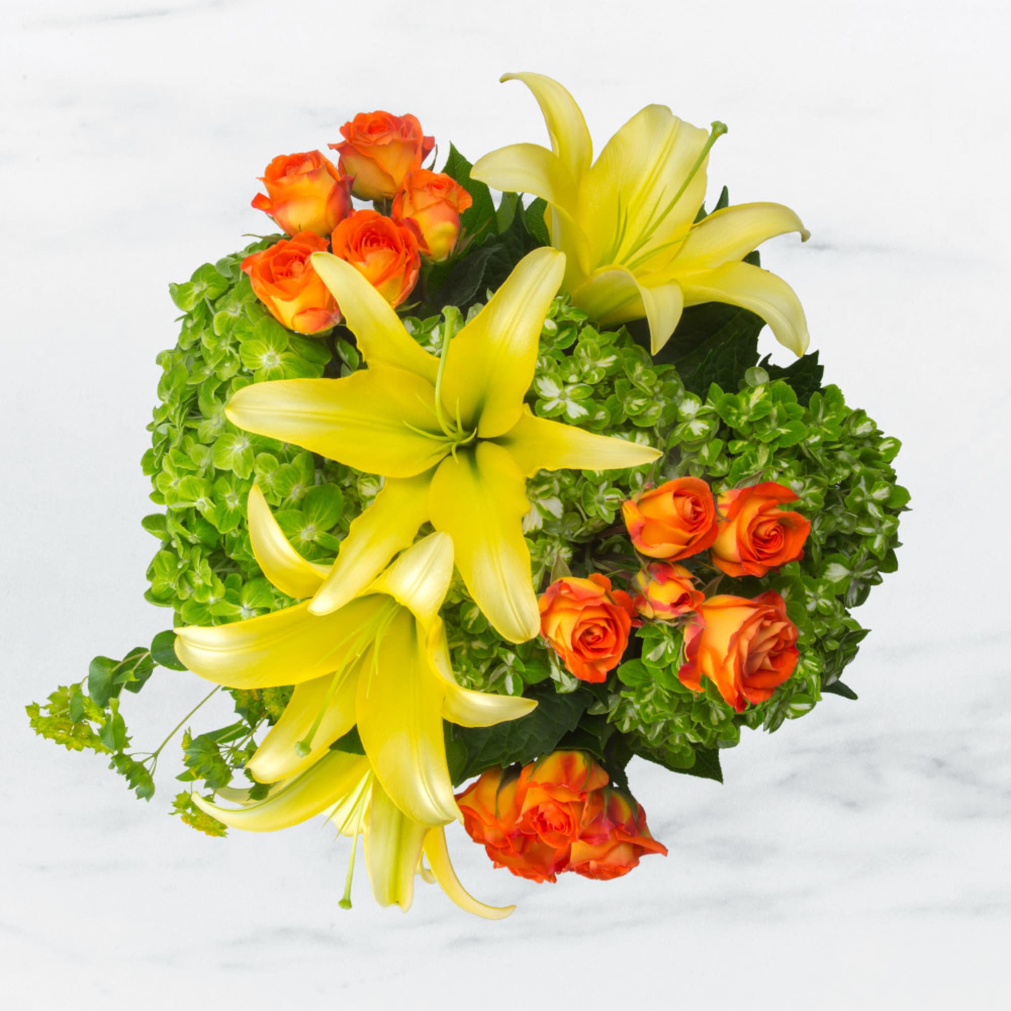 Featuring a vibrant array of lilies, spray roses, and hydrangea, this wonderful Featuring a vibrant array of lilies, spray roses, and hydrangea, this wonderful
