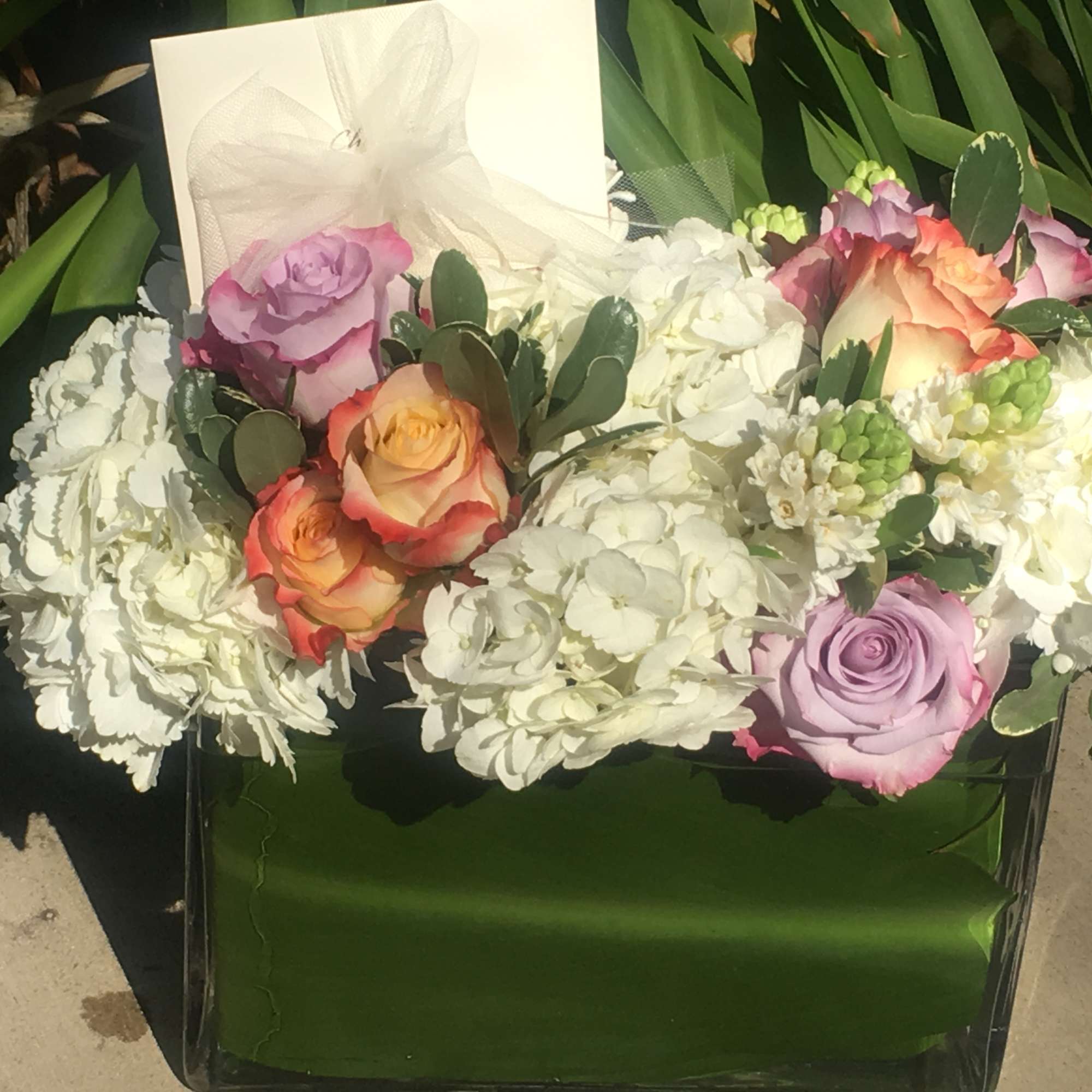 A mixture of beautiful two tone roses, hyacinth, hydrangeas wrapped with tea