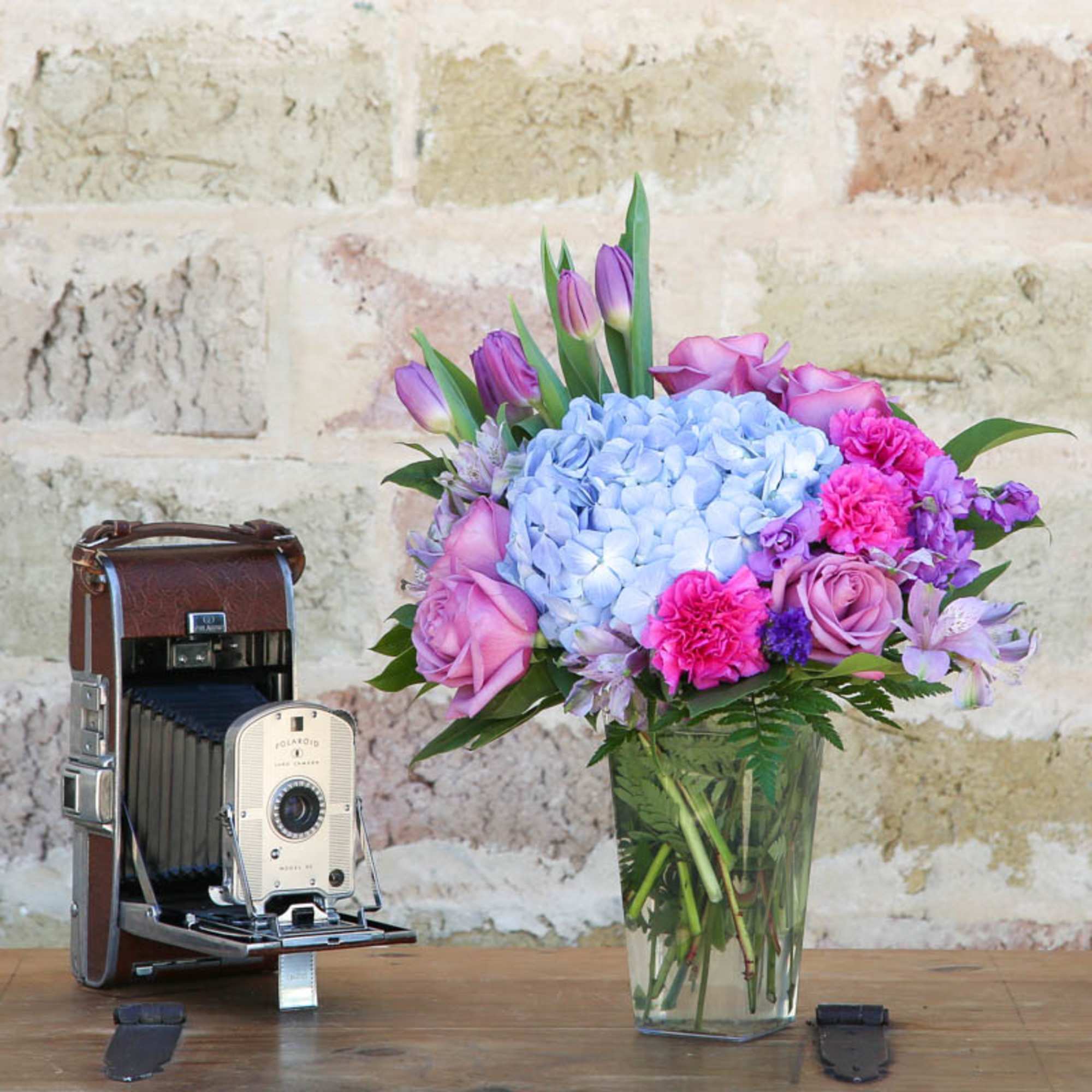 THIS UNIQUE ASSORTED PURPLE FLOWERS BOUQUET WILL IMPRESS ANYONE.