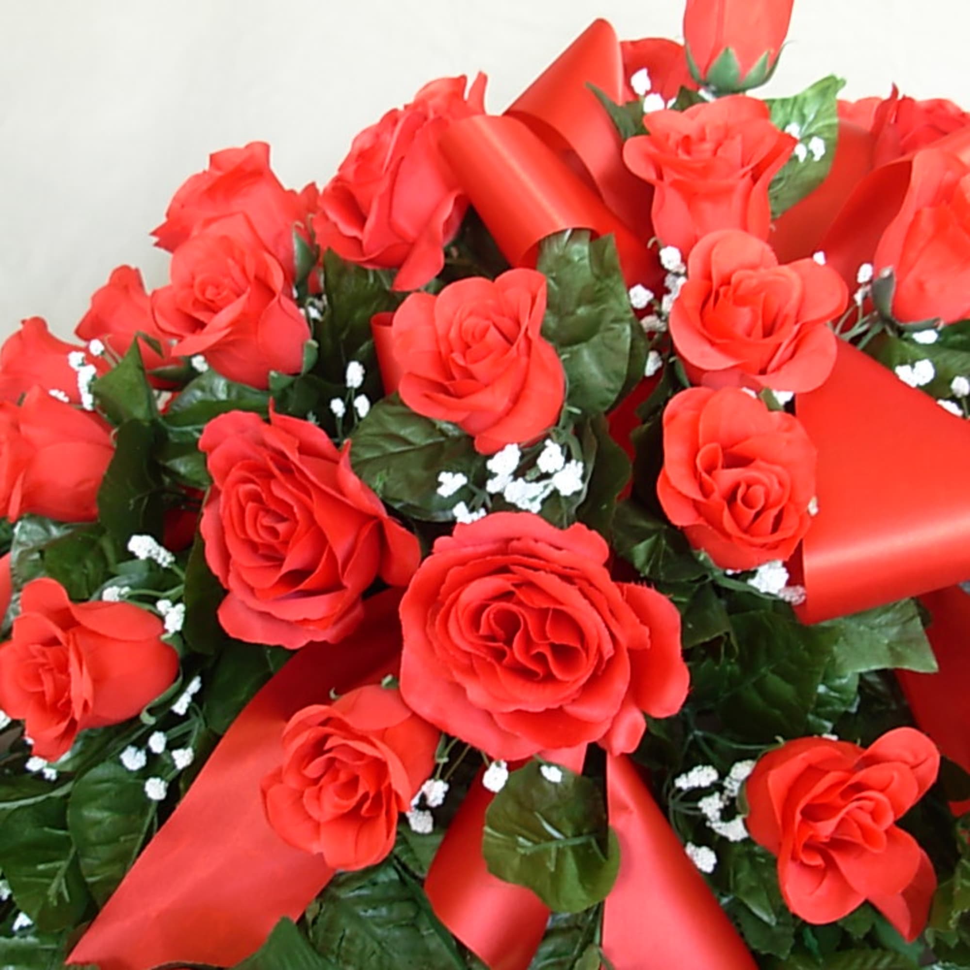 Our all RED ROSE BUD SILK-PERMANENT CASKET SPRAY is an all time