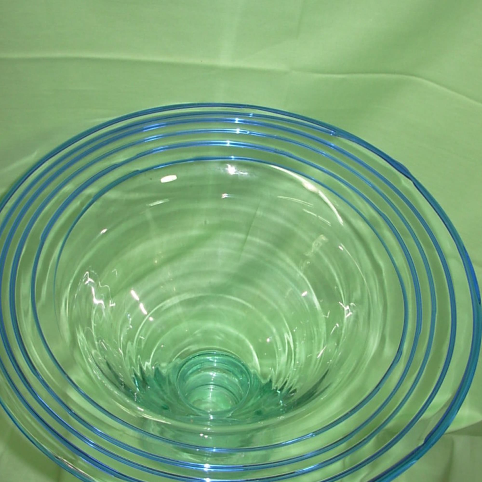 This vintage, mid century modern, hand blown, flared rim, clear and blue