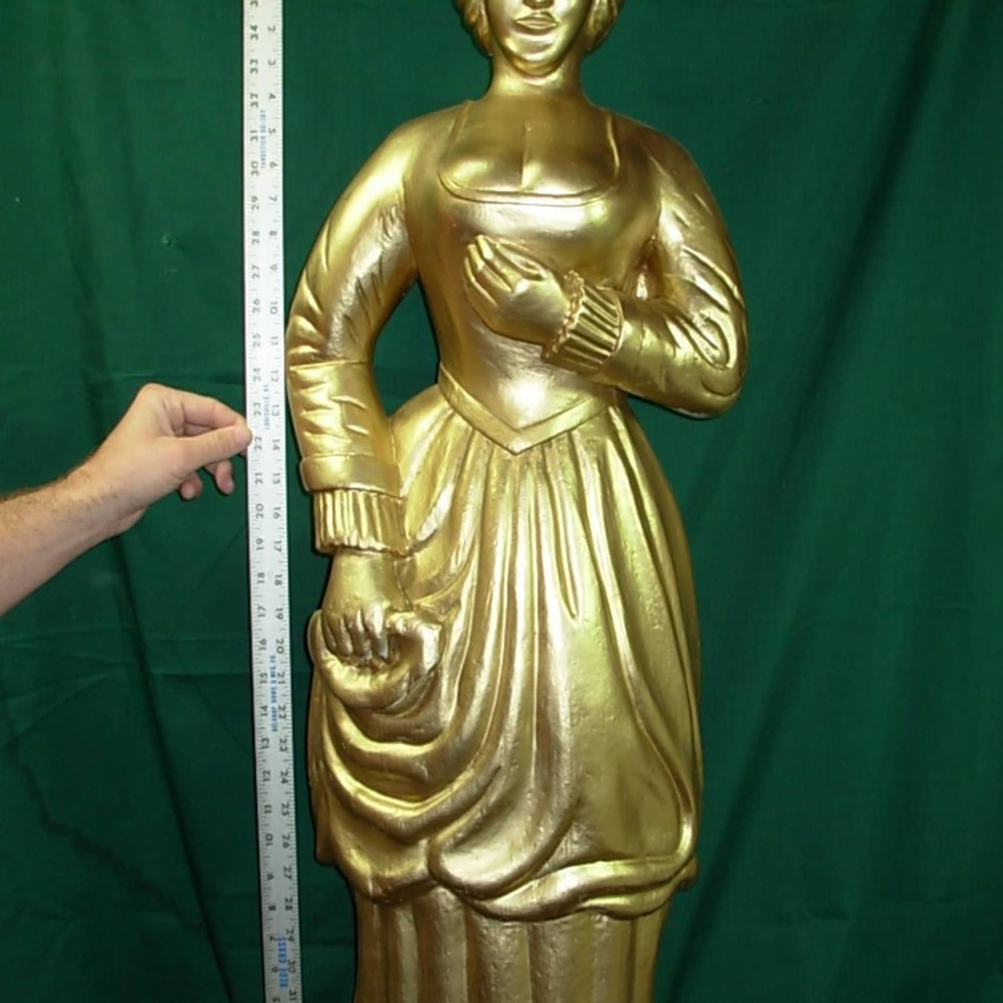 This  ANTIQUE STATUE is of  ( we think ) 