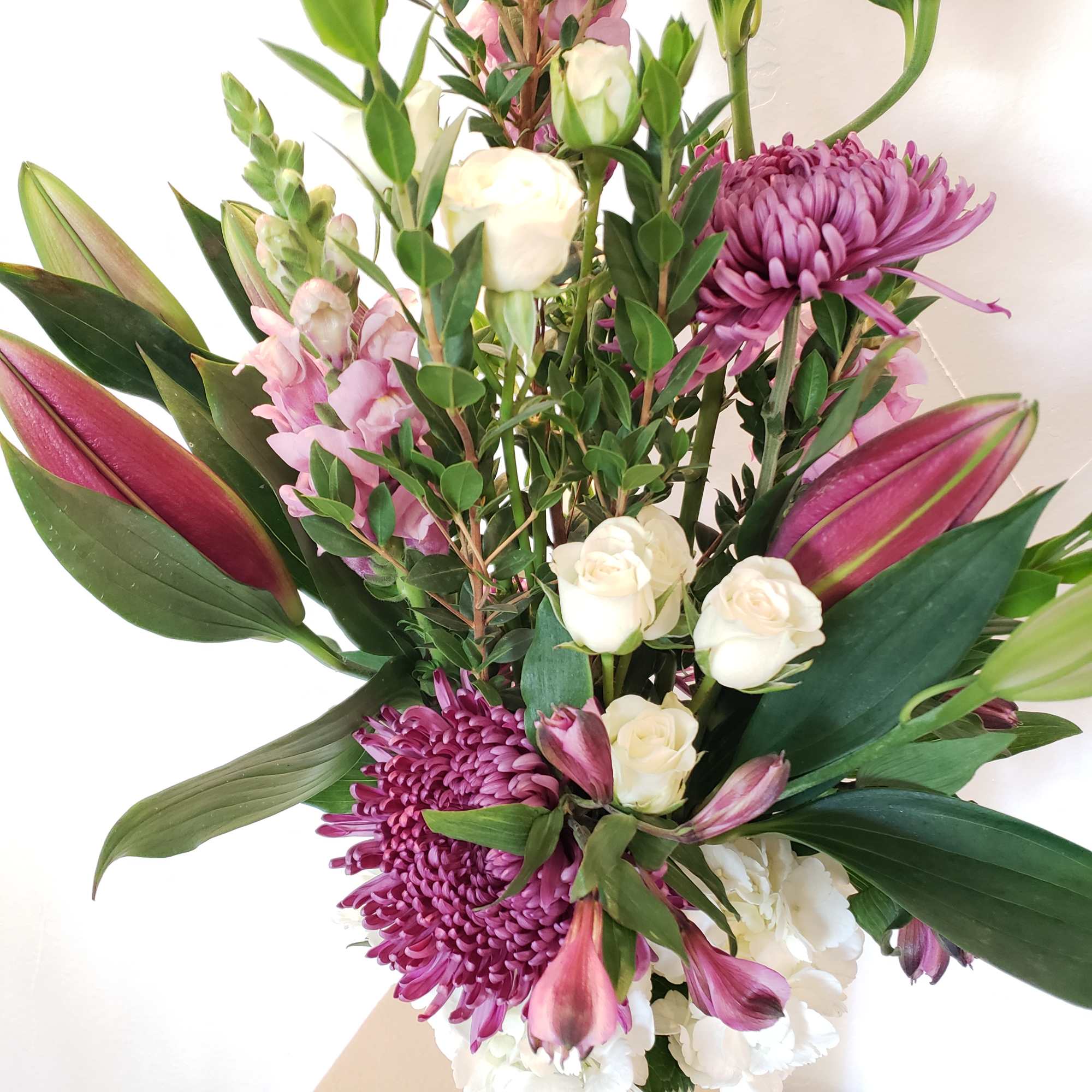 hydrangea, mums, snapdragons, lilies, spider mums, alstromeria, spray roses hydrangea, mums, snapdragons, lilies, spider mums, alstromeria, spray roses