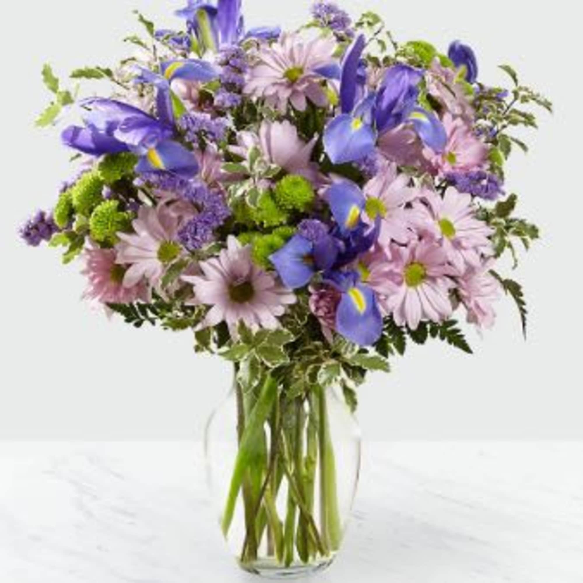 Inviting blue iris blooms add depth and texture to this fresh  Inviting blue iris blooms add depth and texture to this fresh